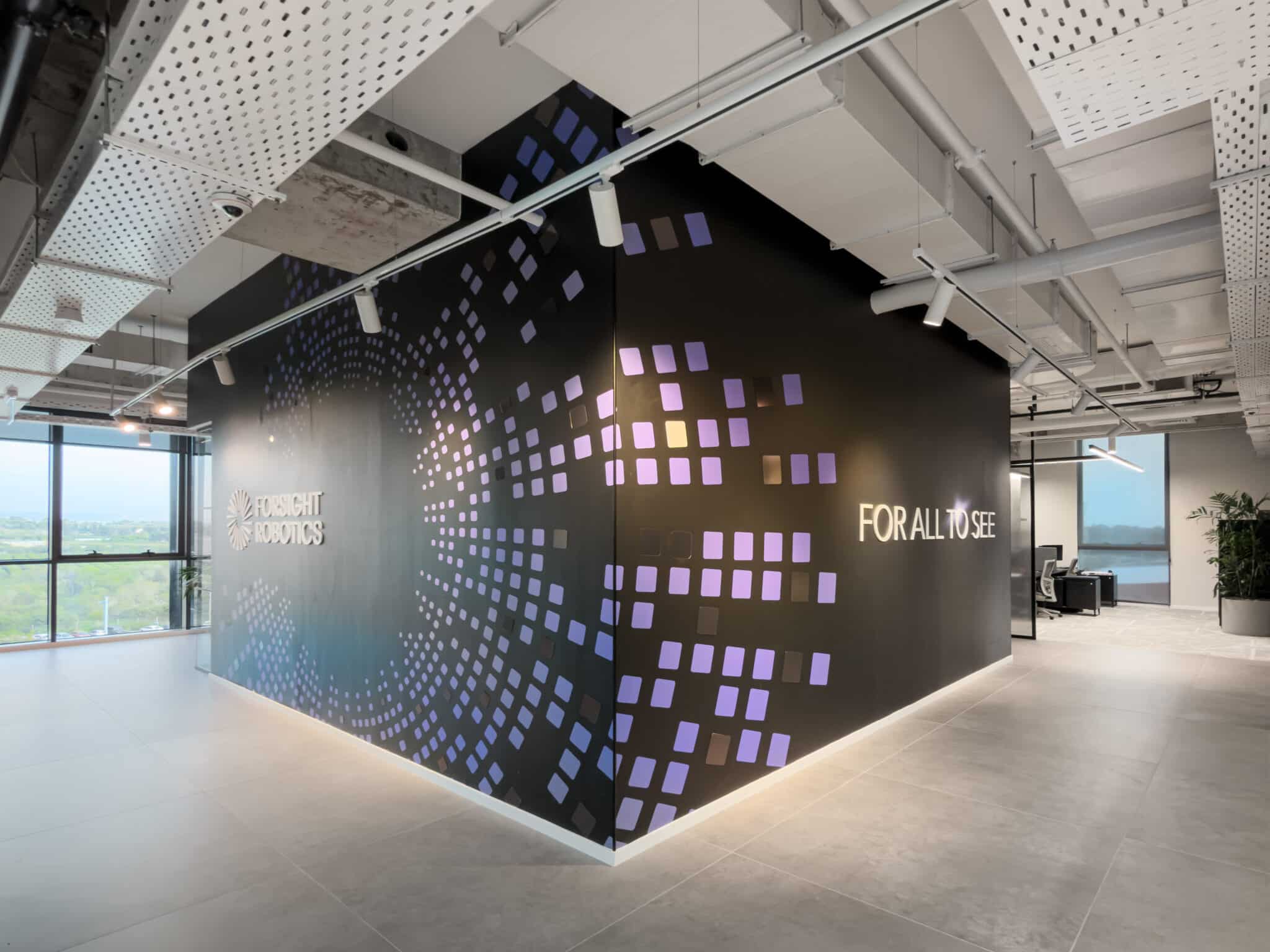 FOR ALL TO SEE lettering and 3D squares on a dark corner wall