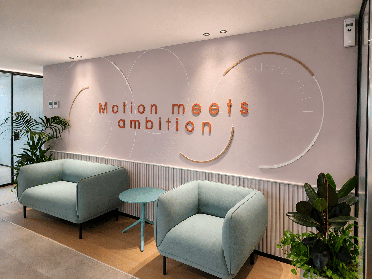 Motion meets ambition 3D lettering with line graphics on a lounge wall