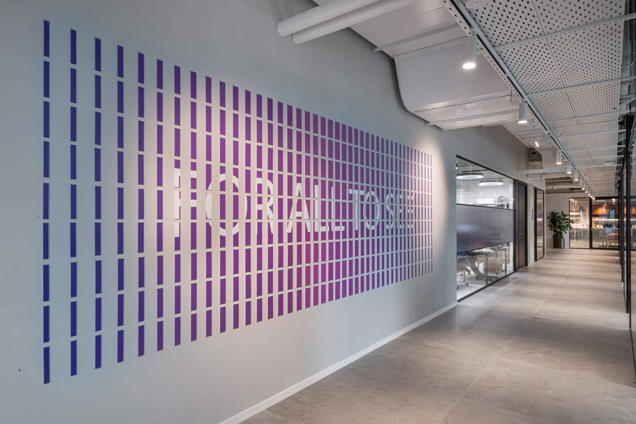 FOR ALL TO SEE lettering formed by a gradient field of wall slats