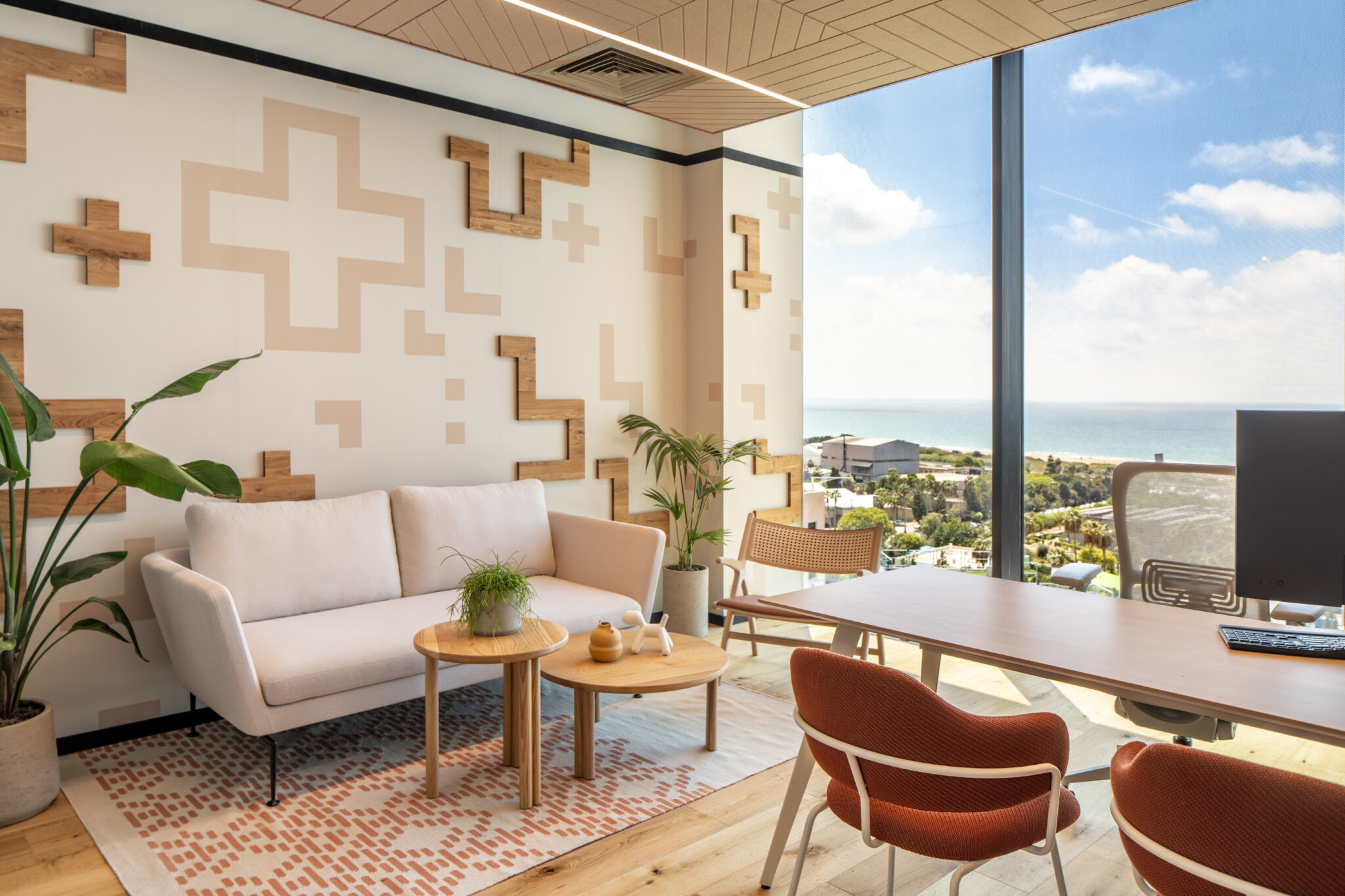 Painted and raised wood cross shapes on an office wall