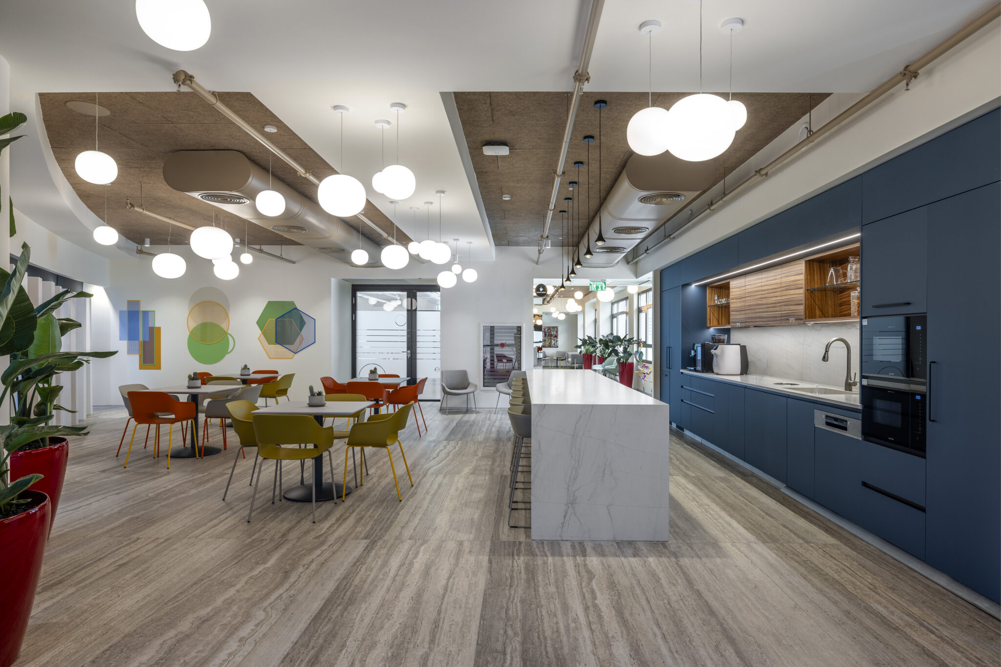 Coloured shape wall graphic in an office kitchen and dining area