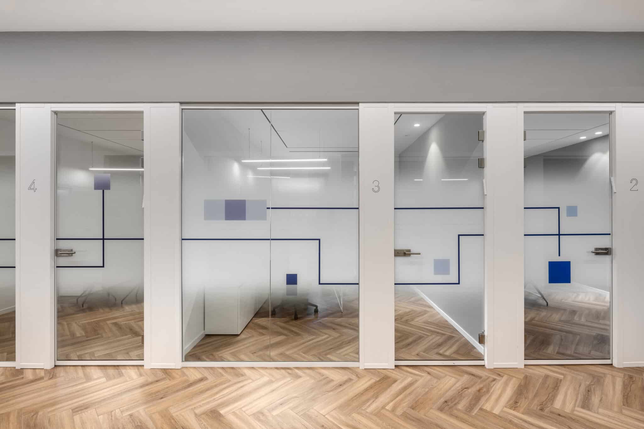 Gradient glass coating with room numbers and line graphics above