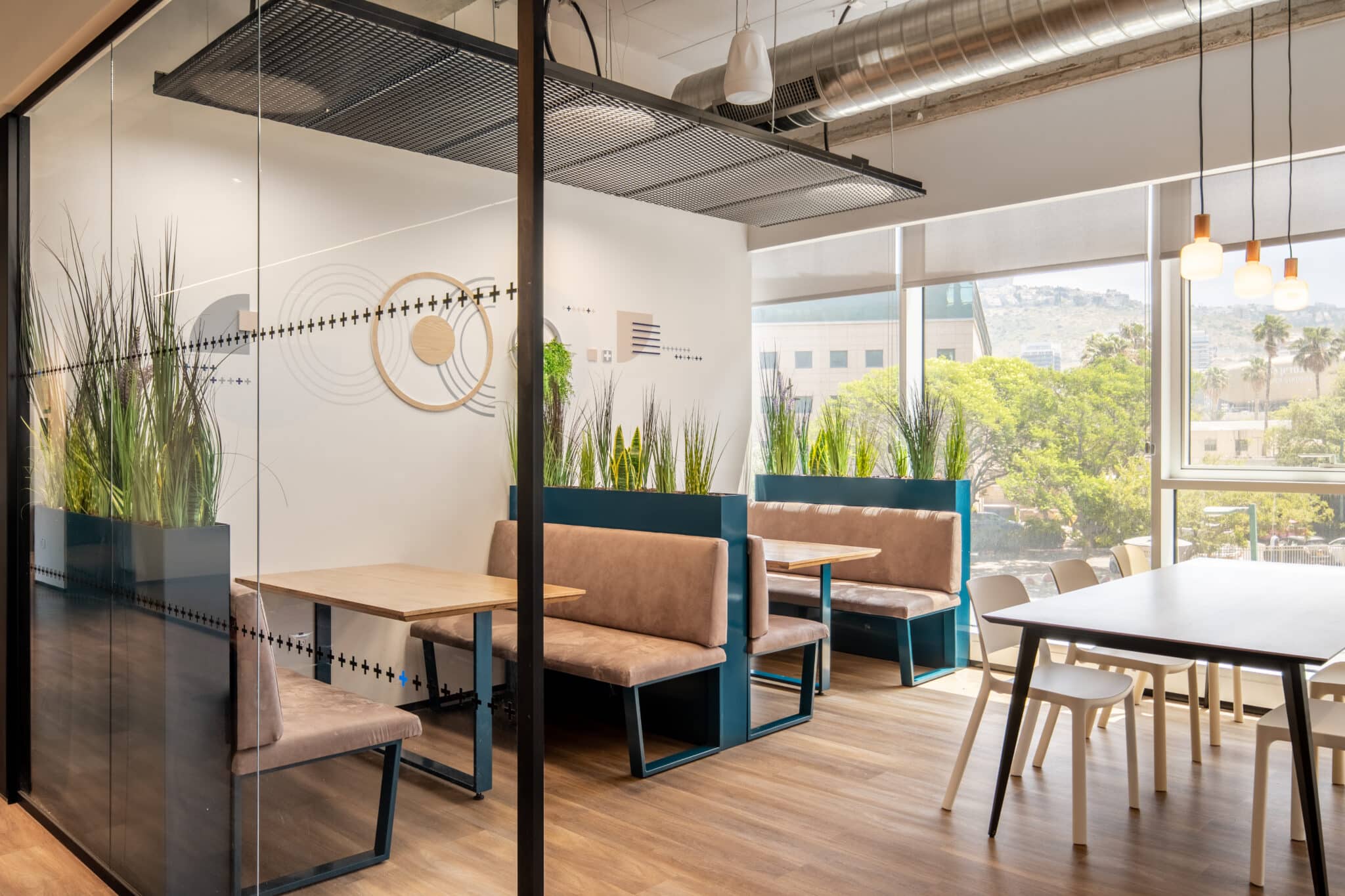 Dotted line on the glass and a round wall graphic above booth seating