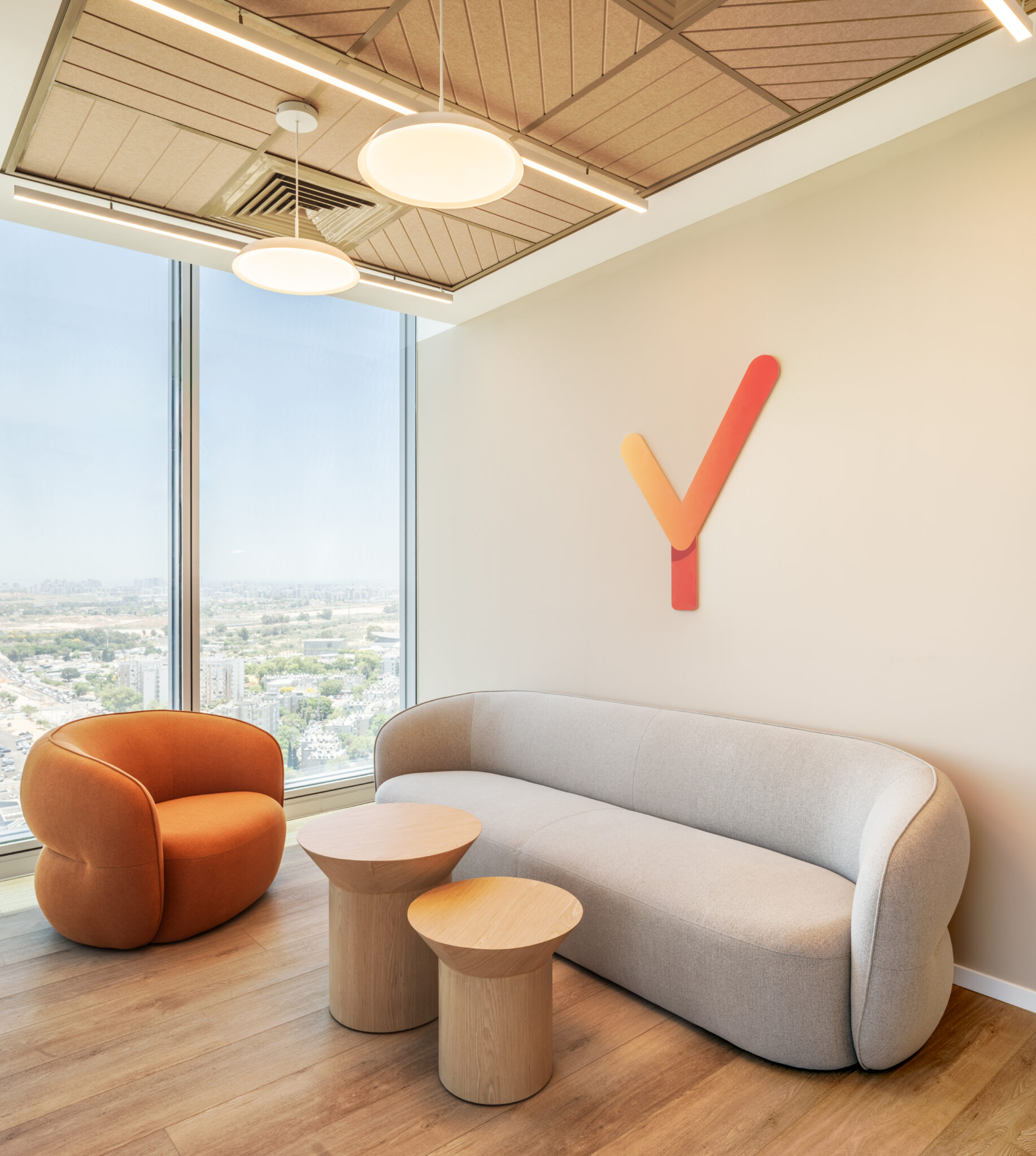 Orange and red 3D letter Y on a lounge wall