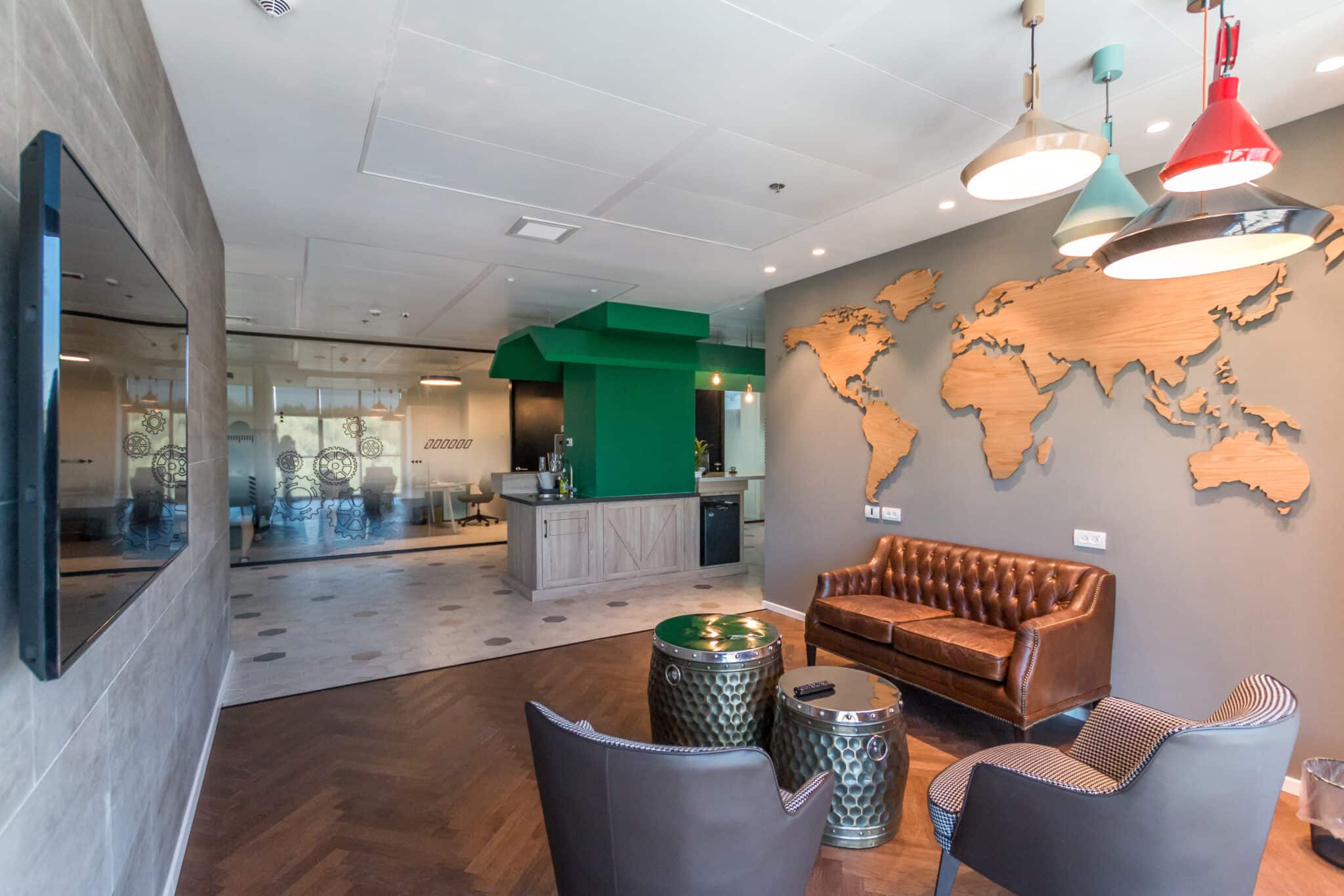 Wood world map wall element above a lounge seating area