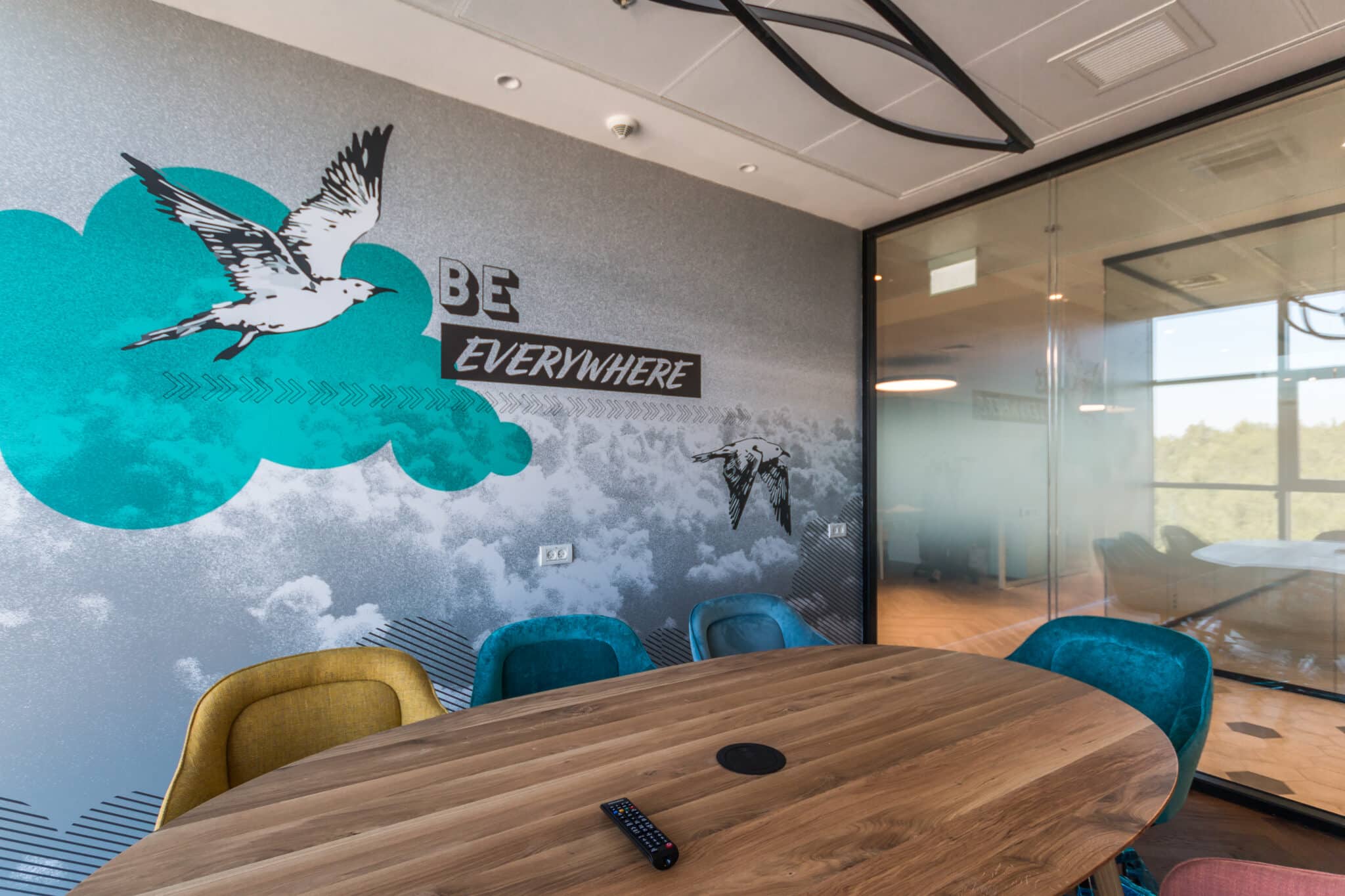 BE EVERYWHERE seagull wall graphic in a meeting room