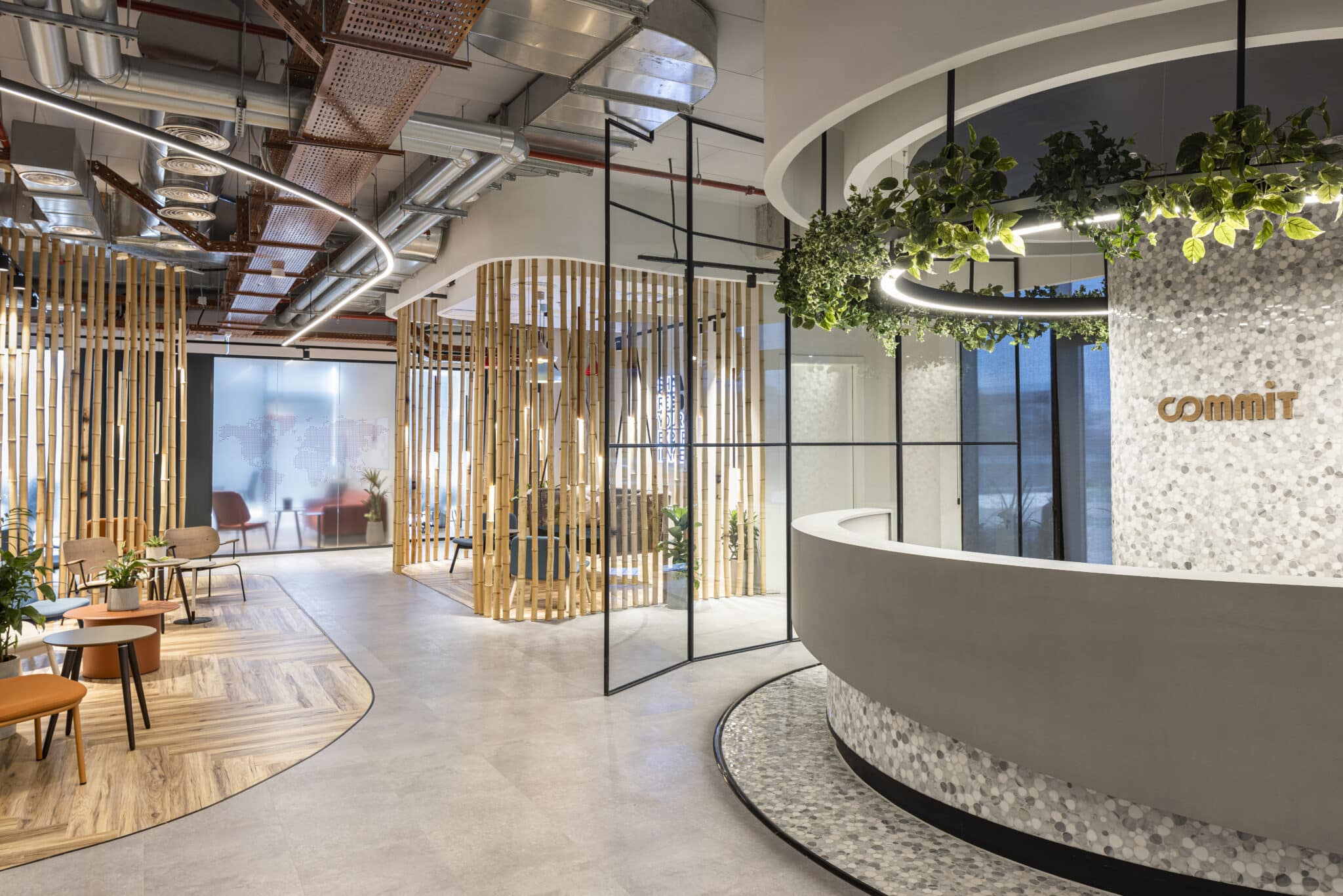 commit logo on a curved terrazzo reception desk