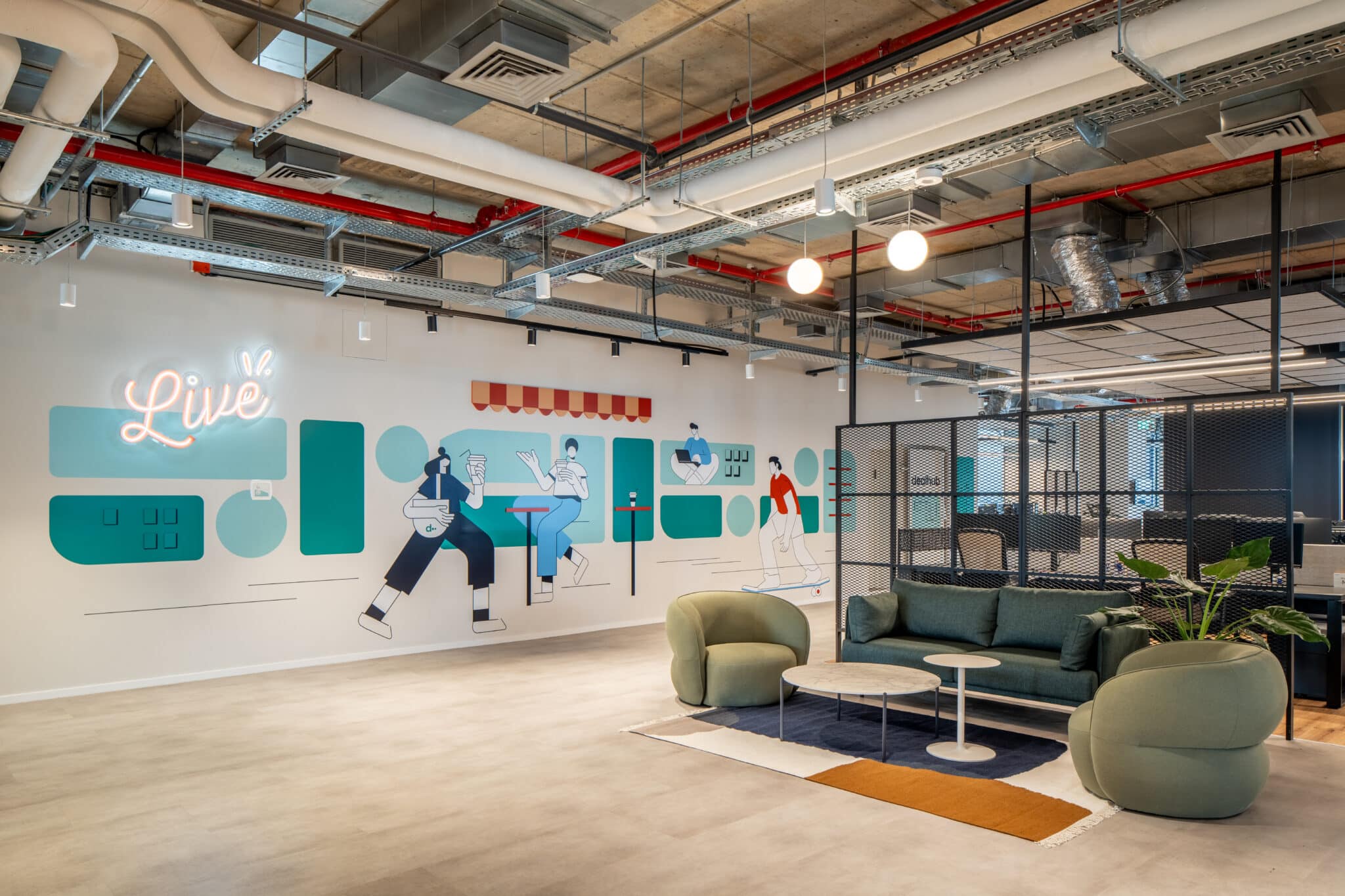 Live wall graphic with figures and neon lettering in an open lounge
