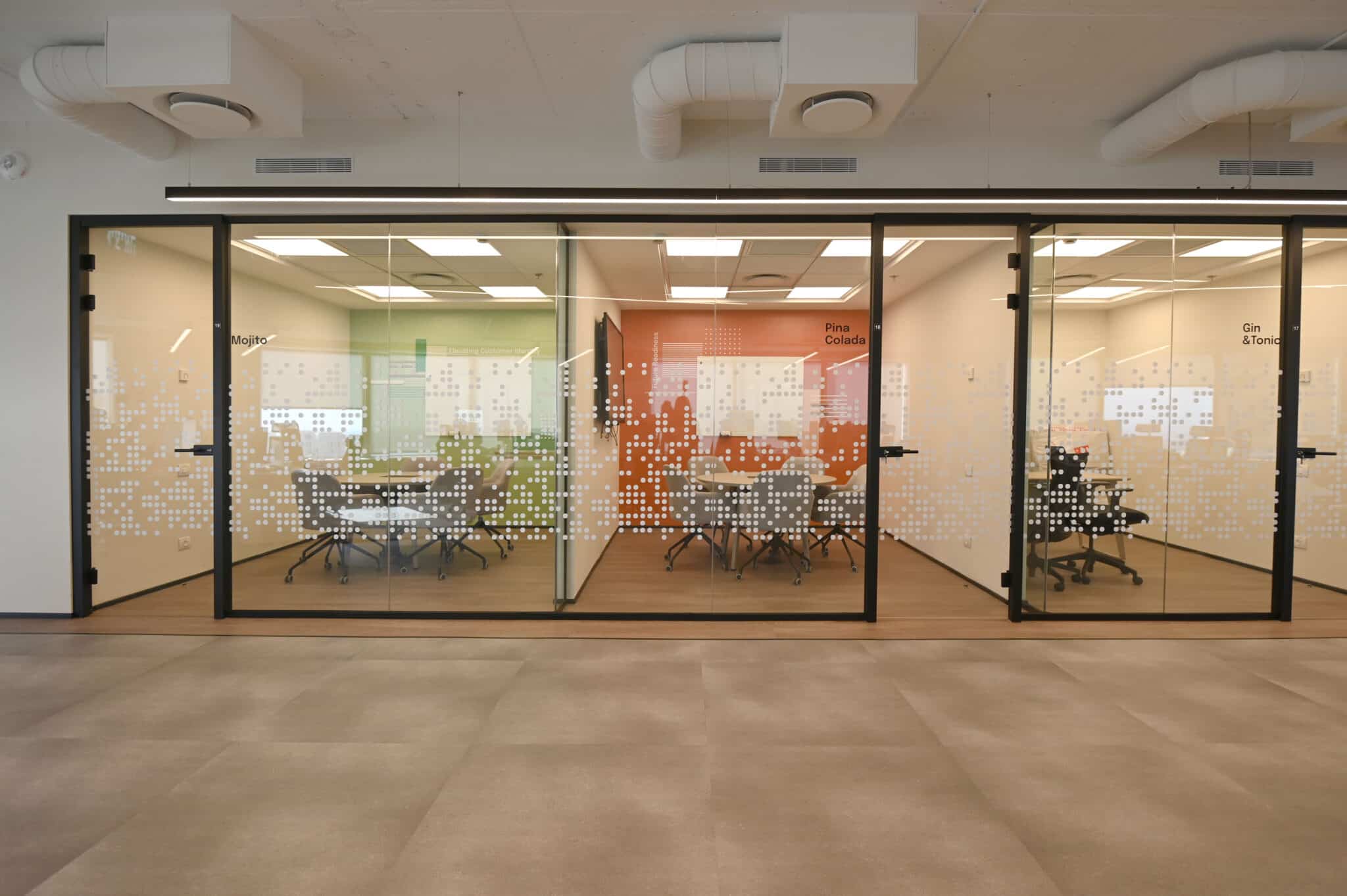 Meeting room glass with coloured dot gradient film and room signage