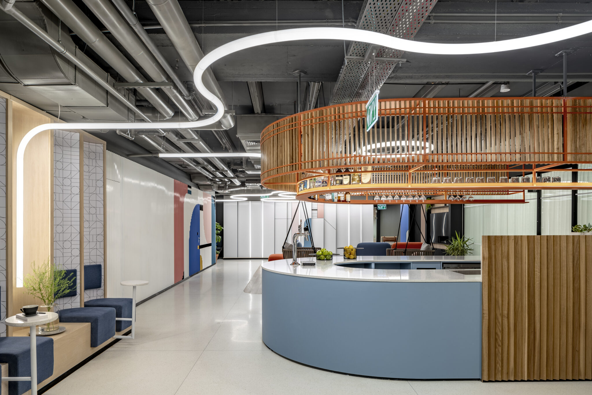 Wall graphics throughout the space behind a curved reception counter