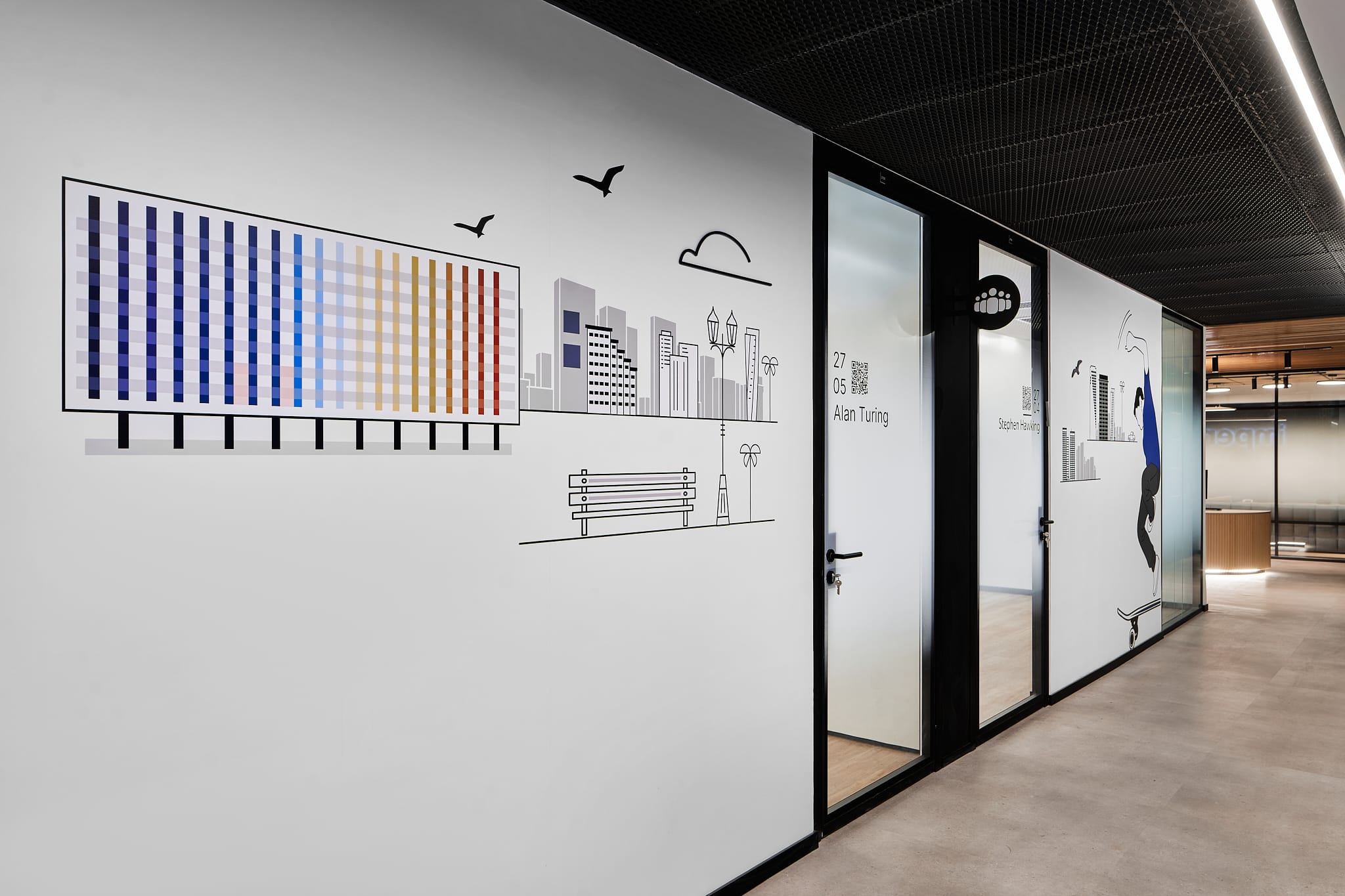Colour chart graphic and city line drawing on a corridor wall