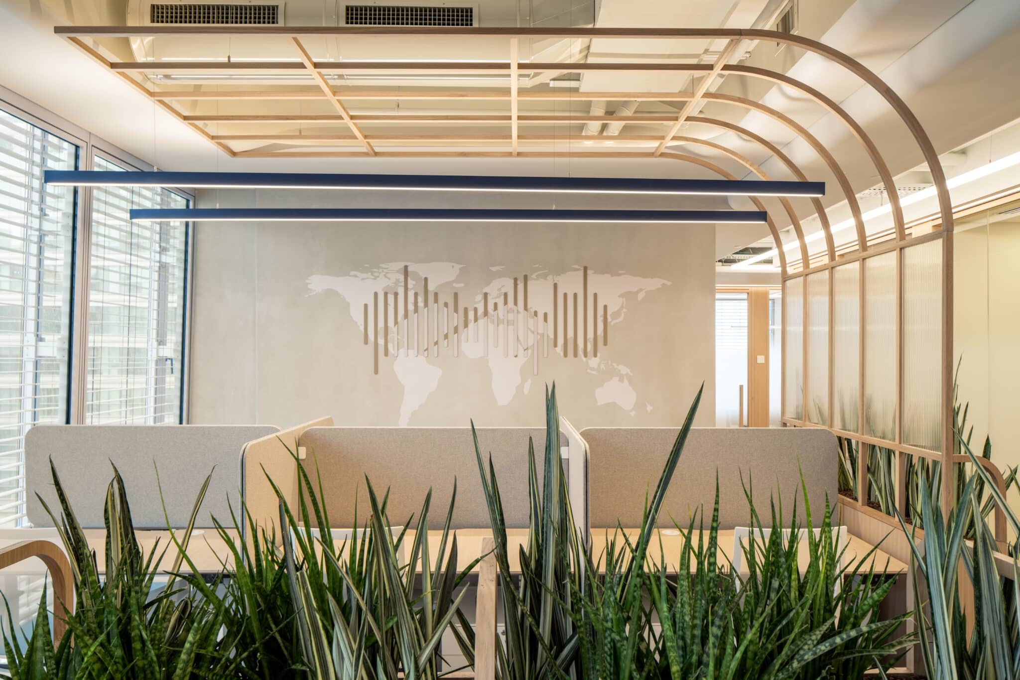 World map wall graphic with a bar chart in an office lounge