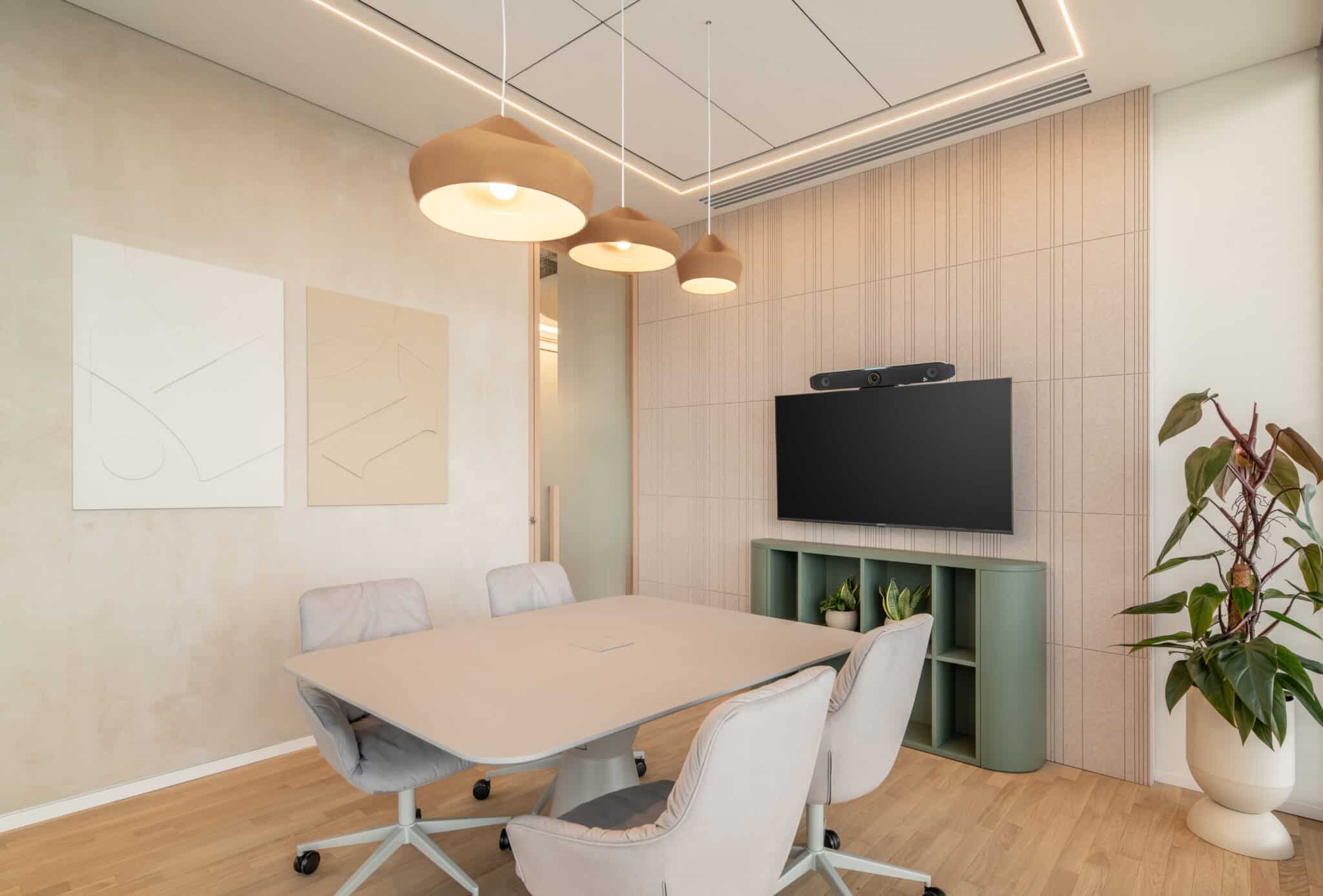 Two framed layered graphics in a meeting room