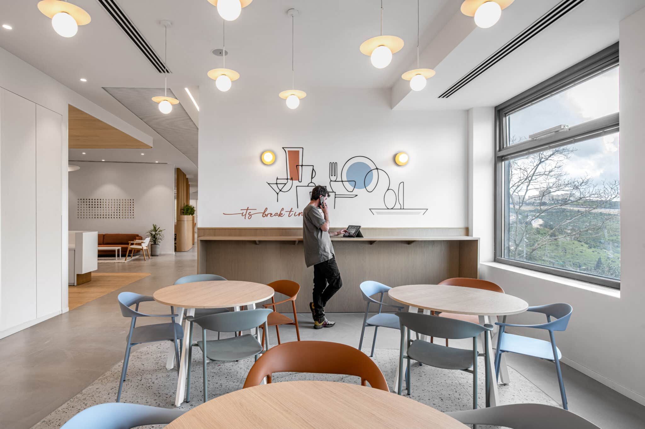 Its break time wall graphic with line drawings above a kitchen counter