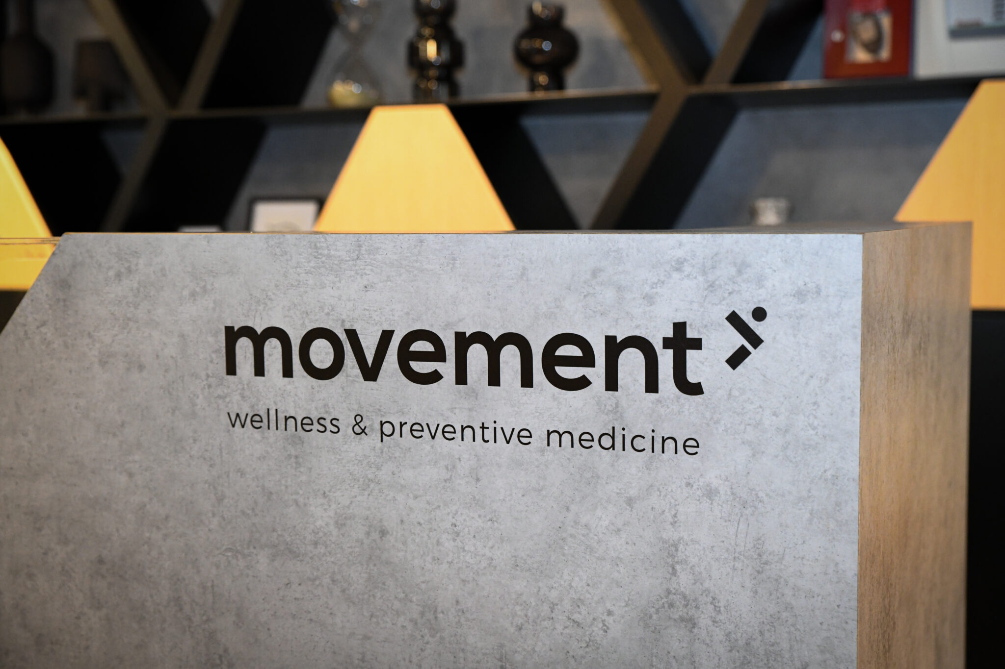 movement logo on the reception desk front panel