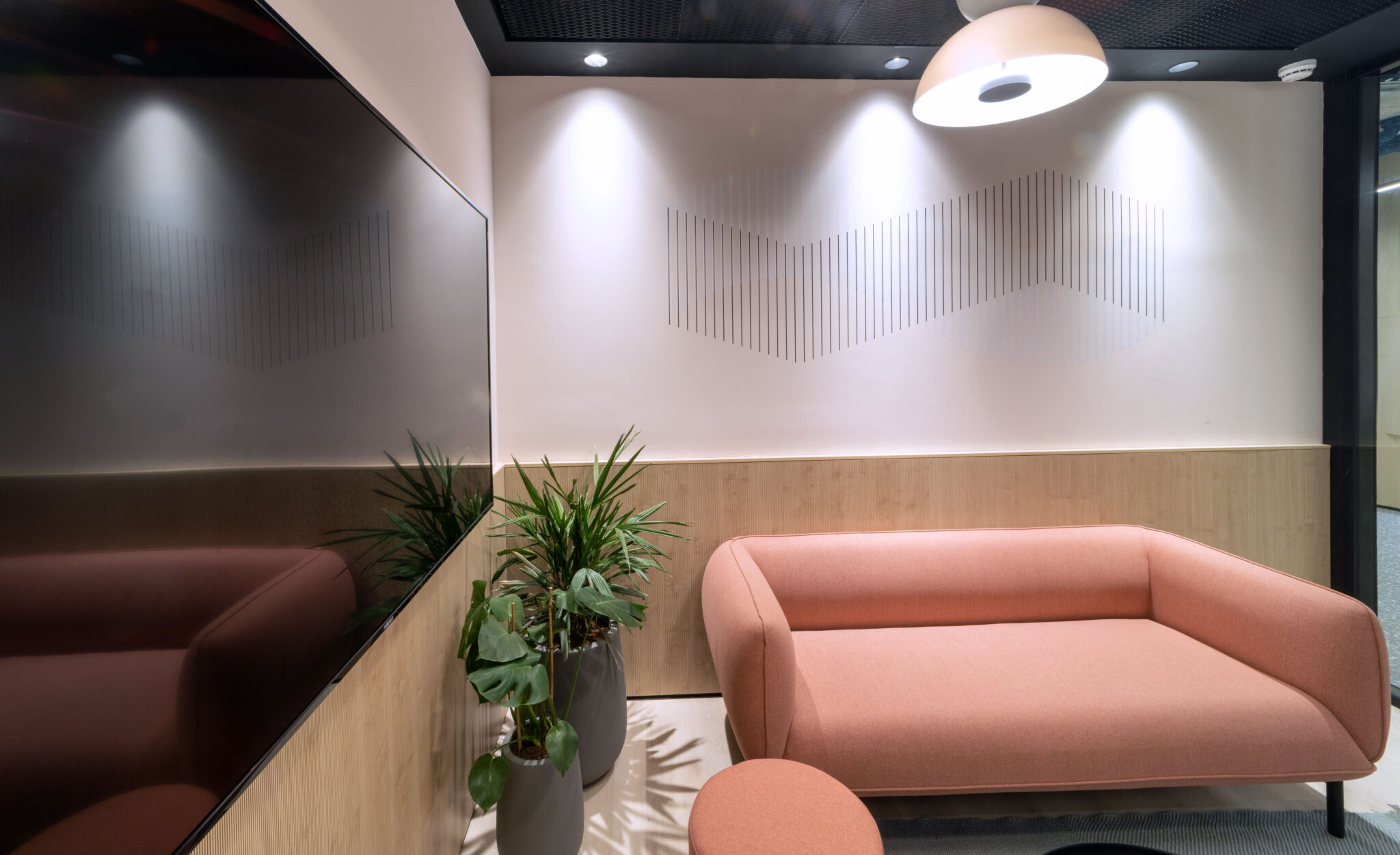 Fine line wave wall graphic in a lounge seating area