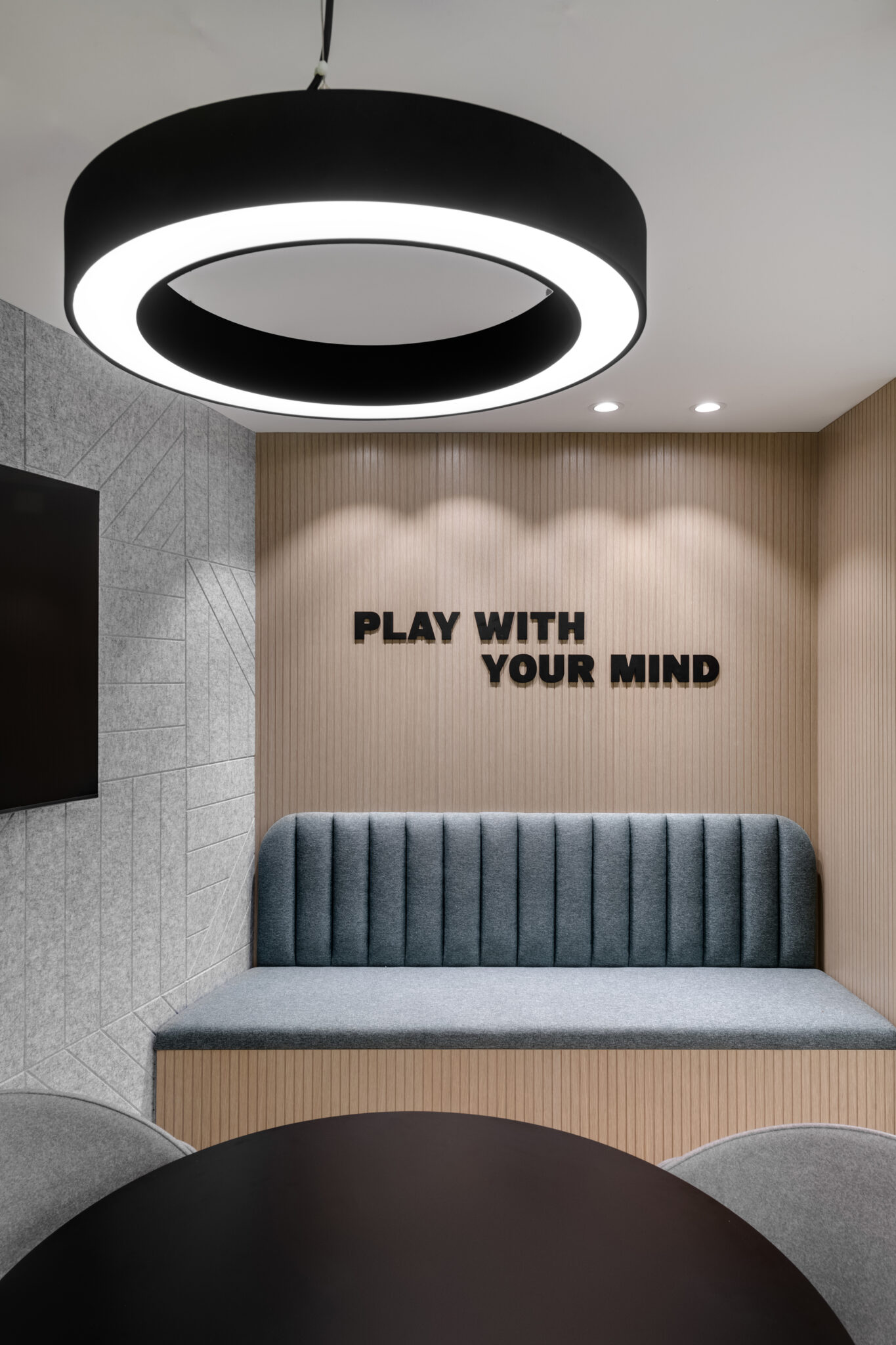 PLAY WITH YOUR MIND 3D letters on a fluted wood wall