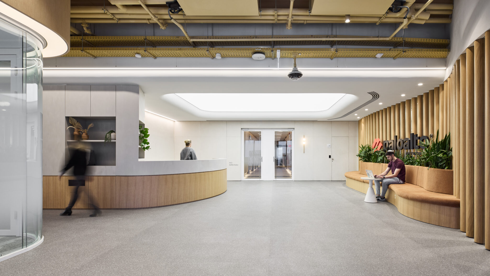 paloalto logo on a slatted timber wall above curved bench seating