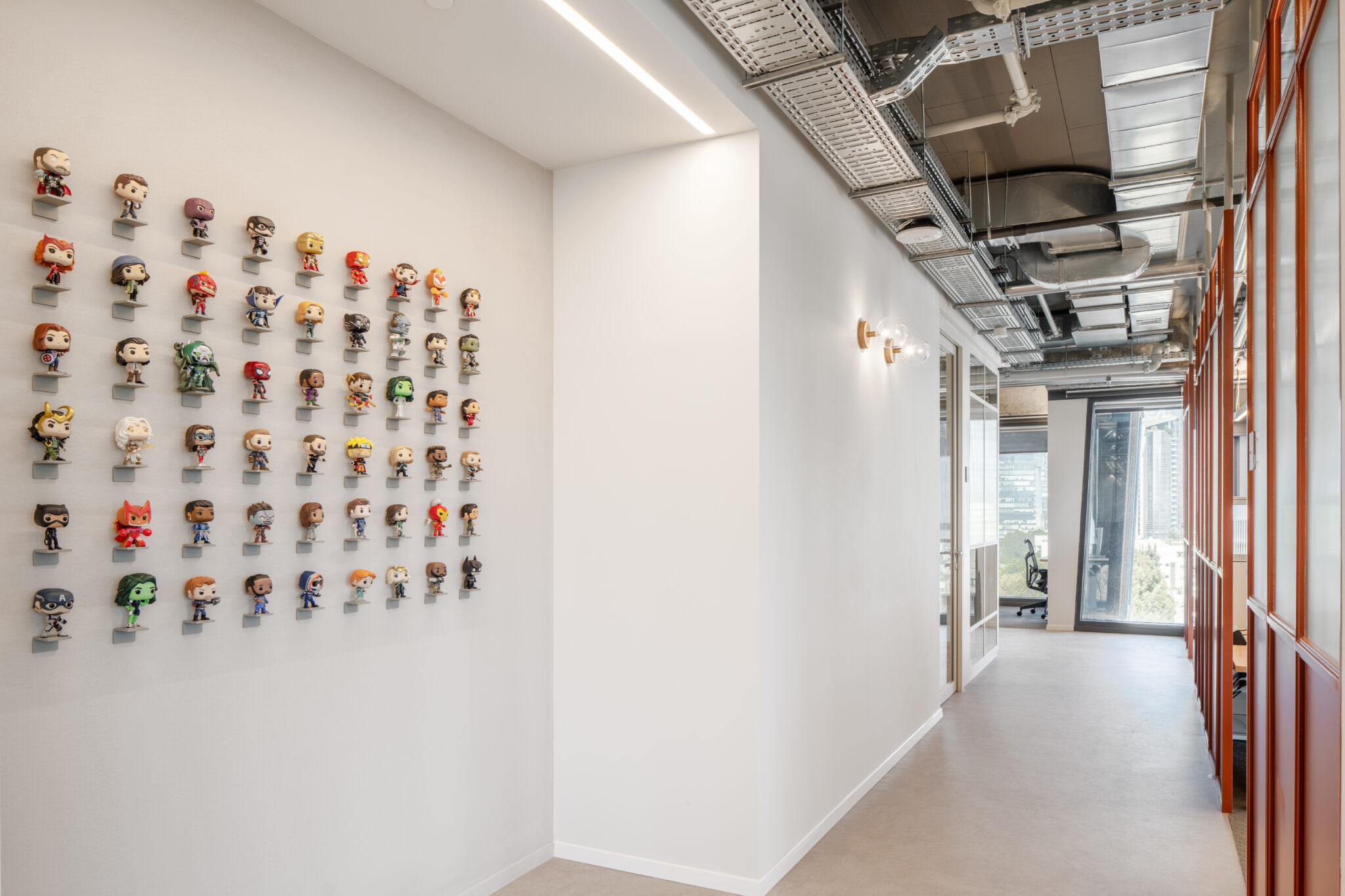 3D character figures displayed on small shelves along a wall