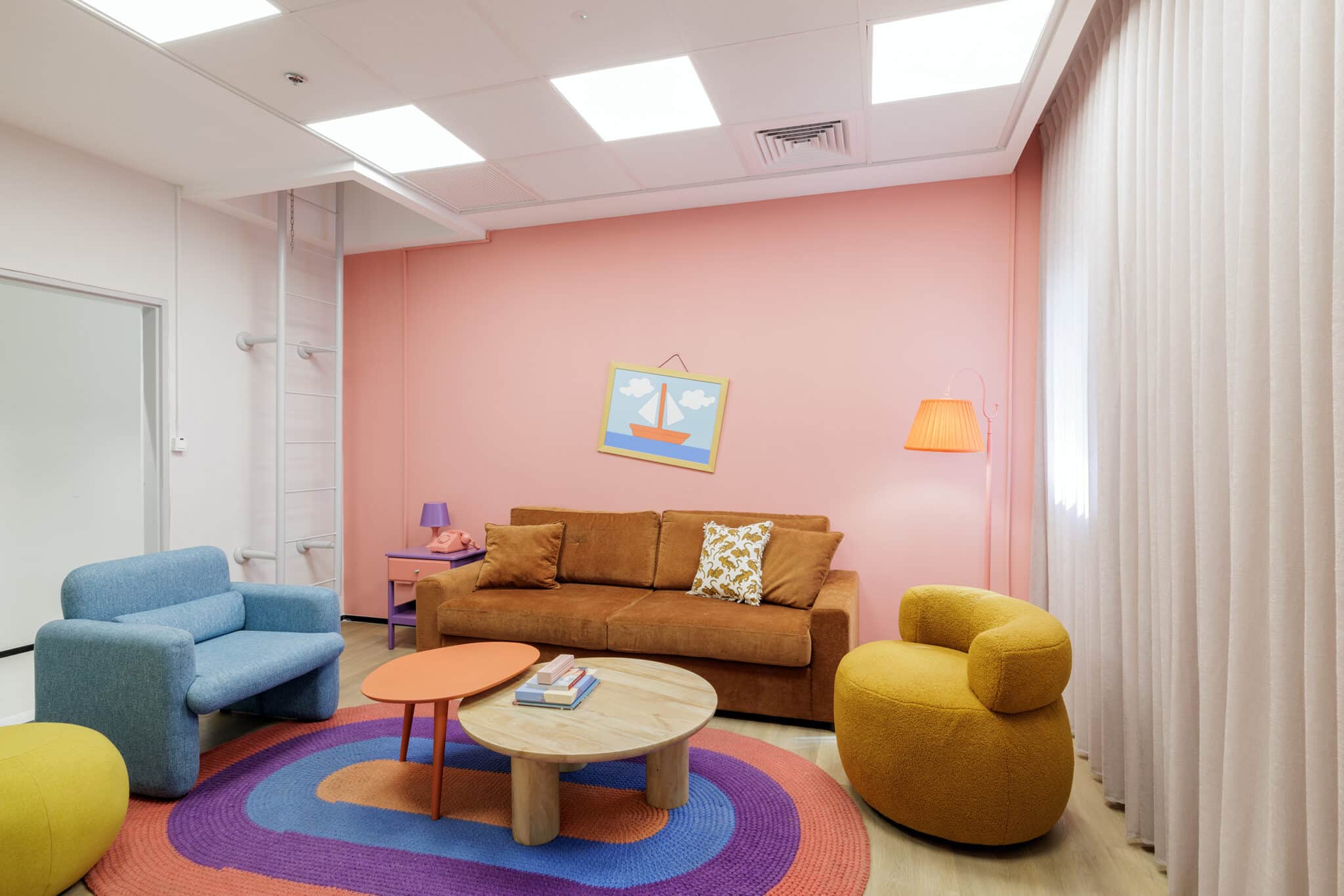 Framed picture on a pink lounge wall