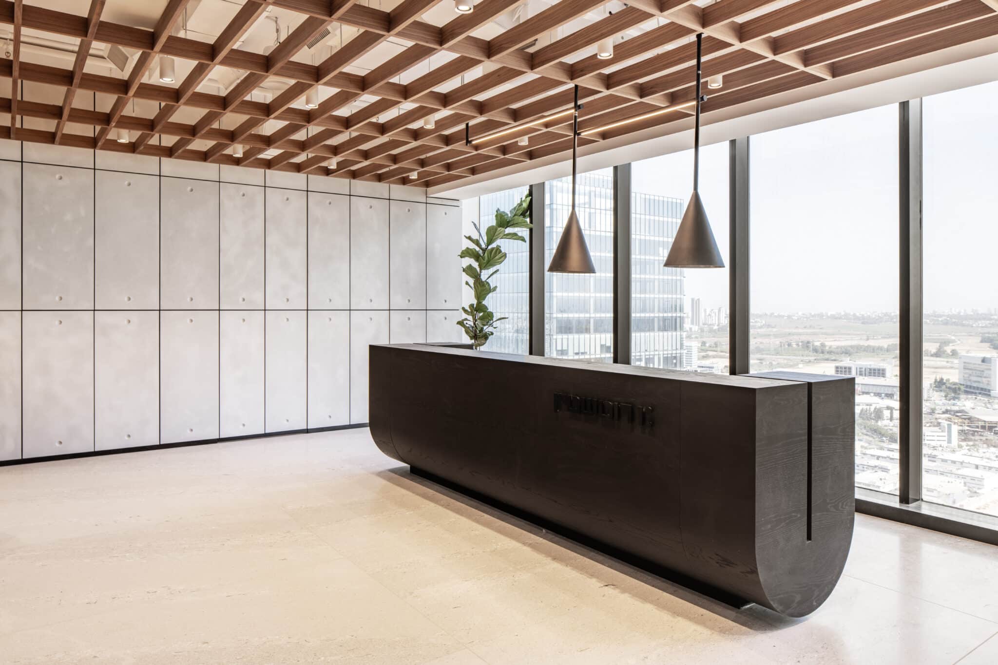 Rotshtein logo on the dark reception desk front