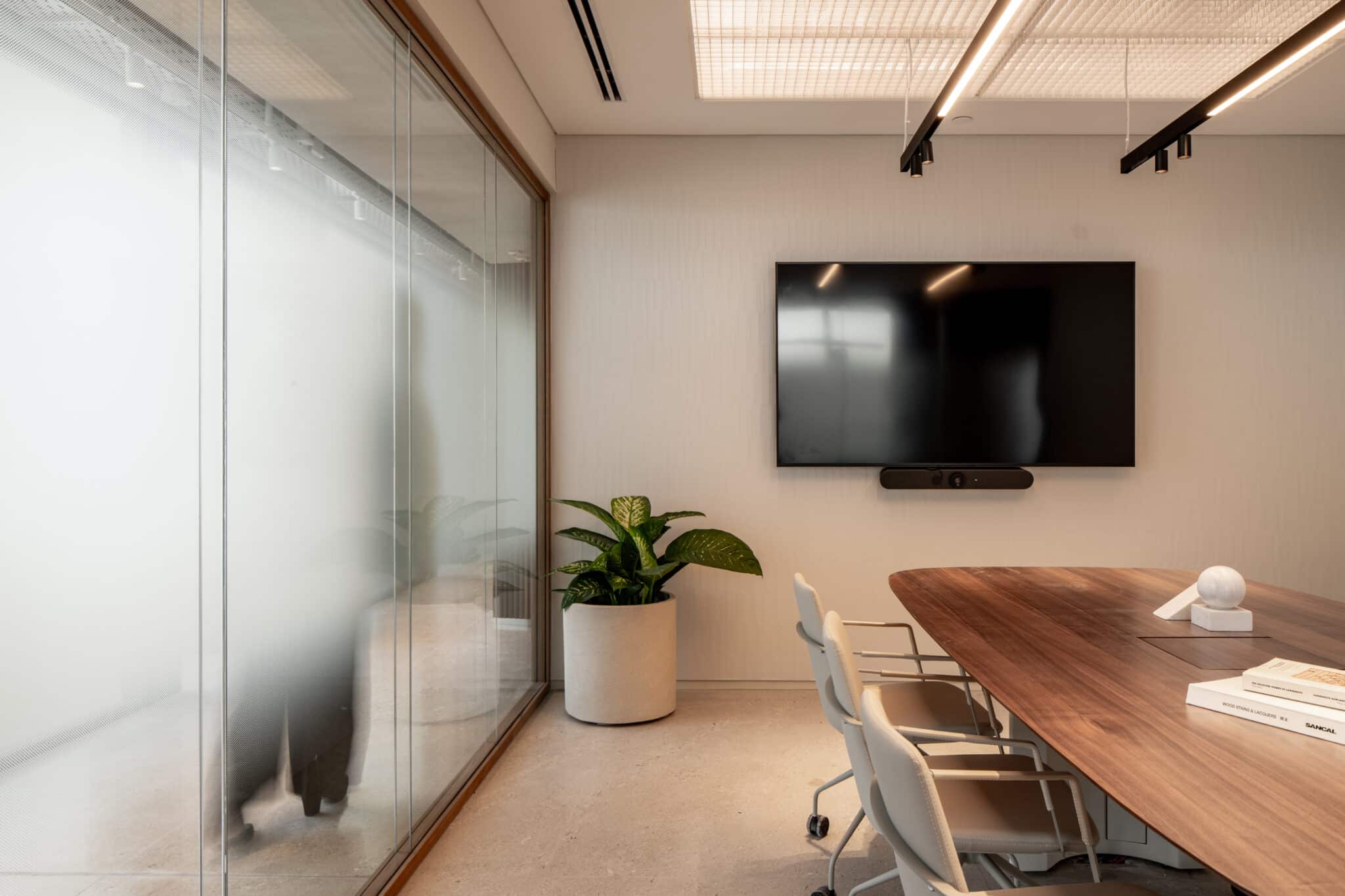 Frosted gradient glass wall inside a small meeting room