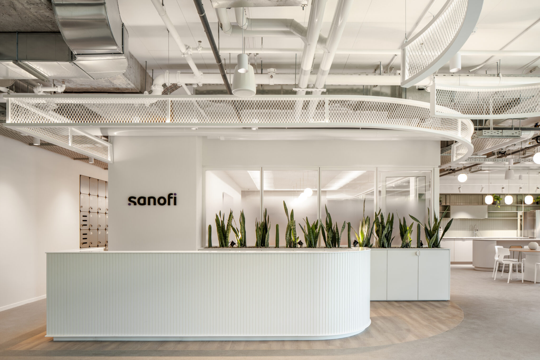 sanofi 3D logo above a curved fluted reception counter
