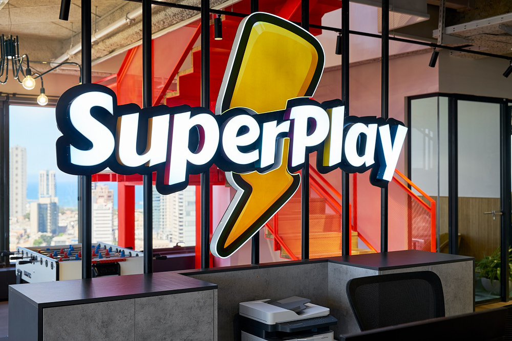 Close-up of the backlit 3D SuperPlay logo sign