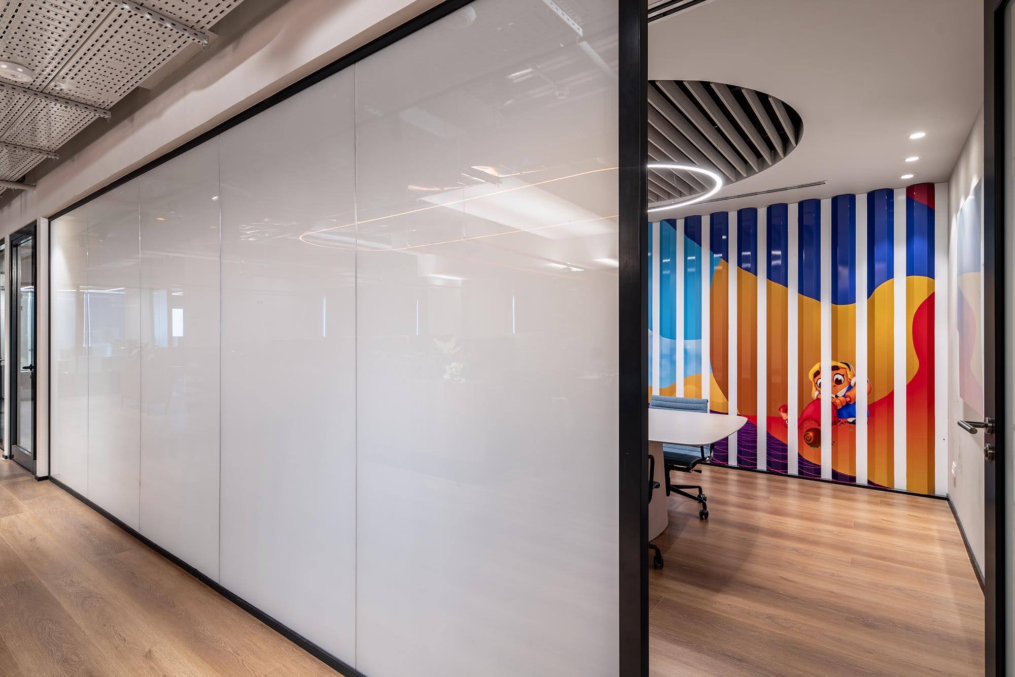 Smart glass switched opaque on a meeting room wall