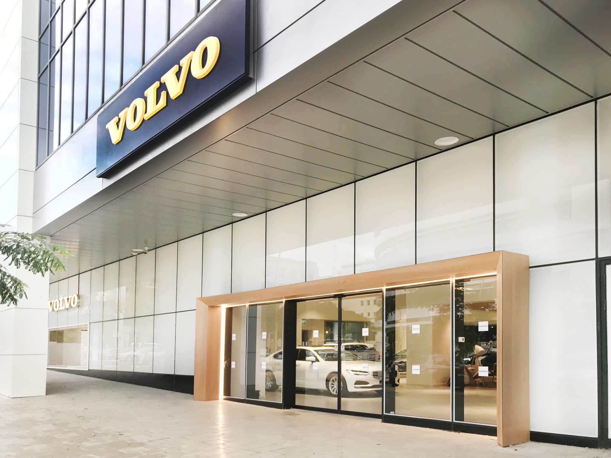VOLVO illuminated sign above a showroom entrance