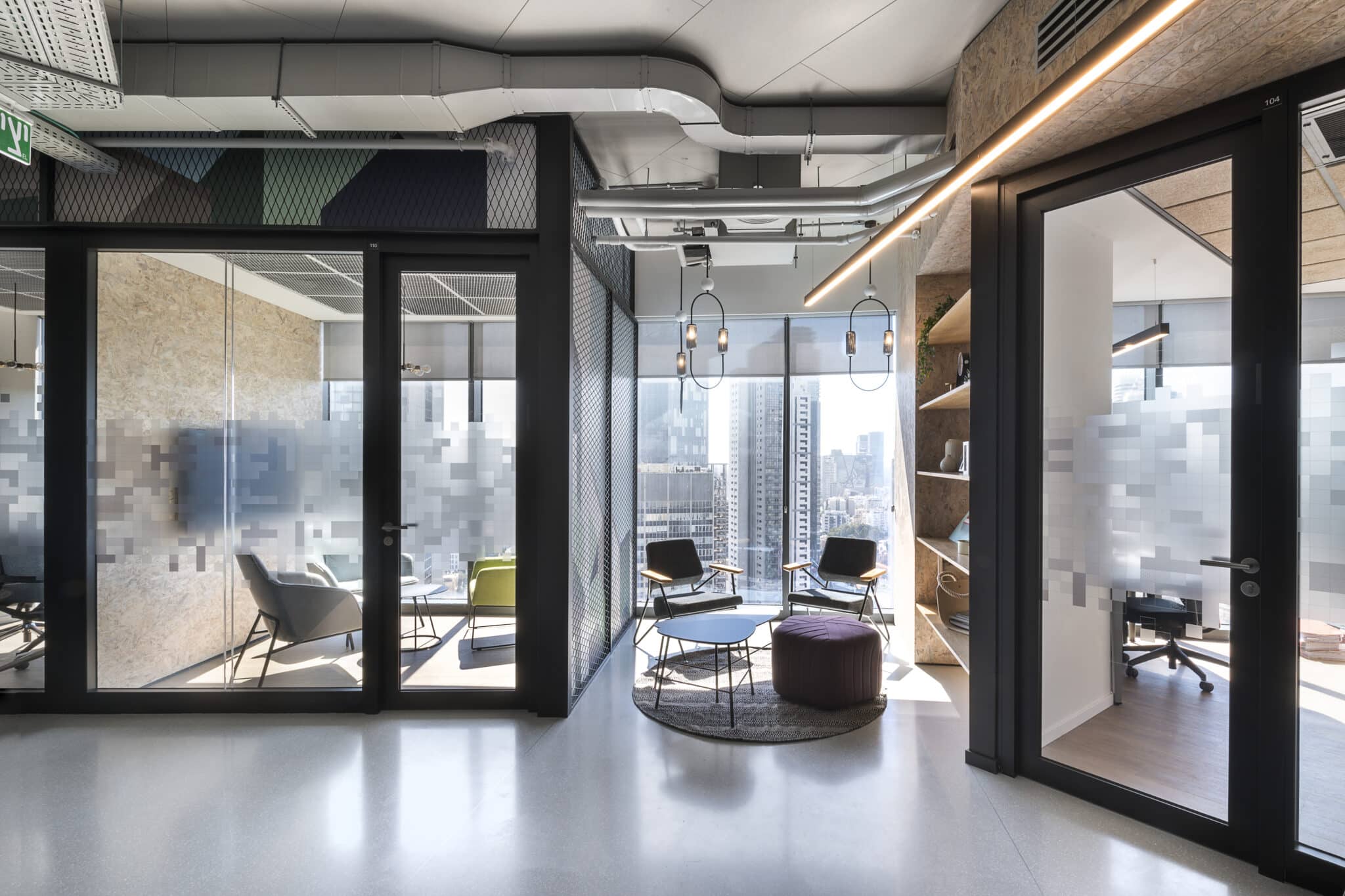 Frosted glass coating with scattered pixels on meeting room walls