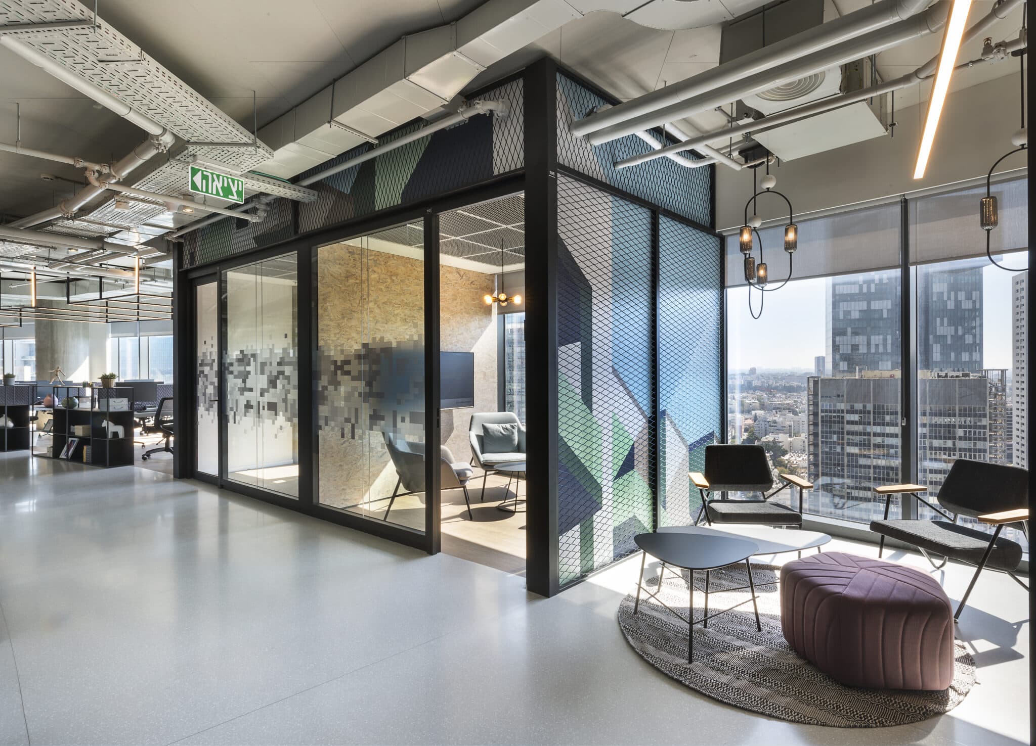 Meeting room wrapped in printed glass with a green and blue pattern