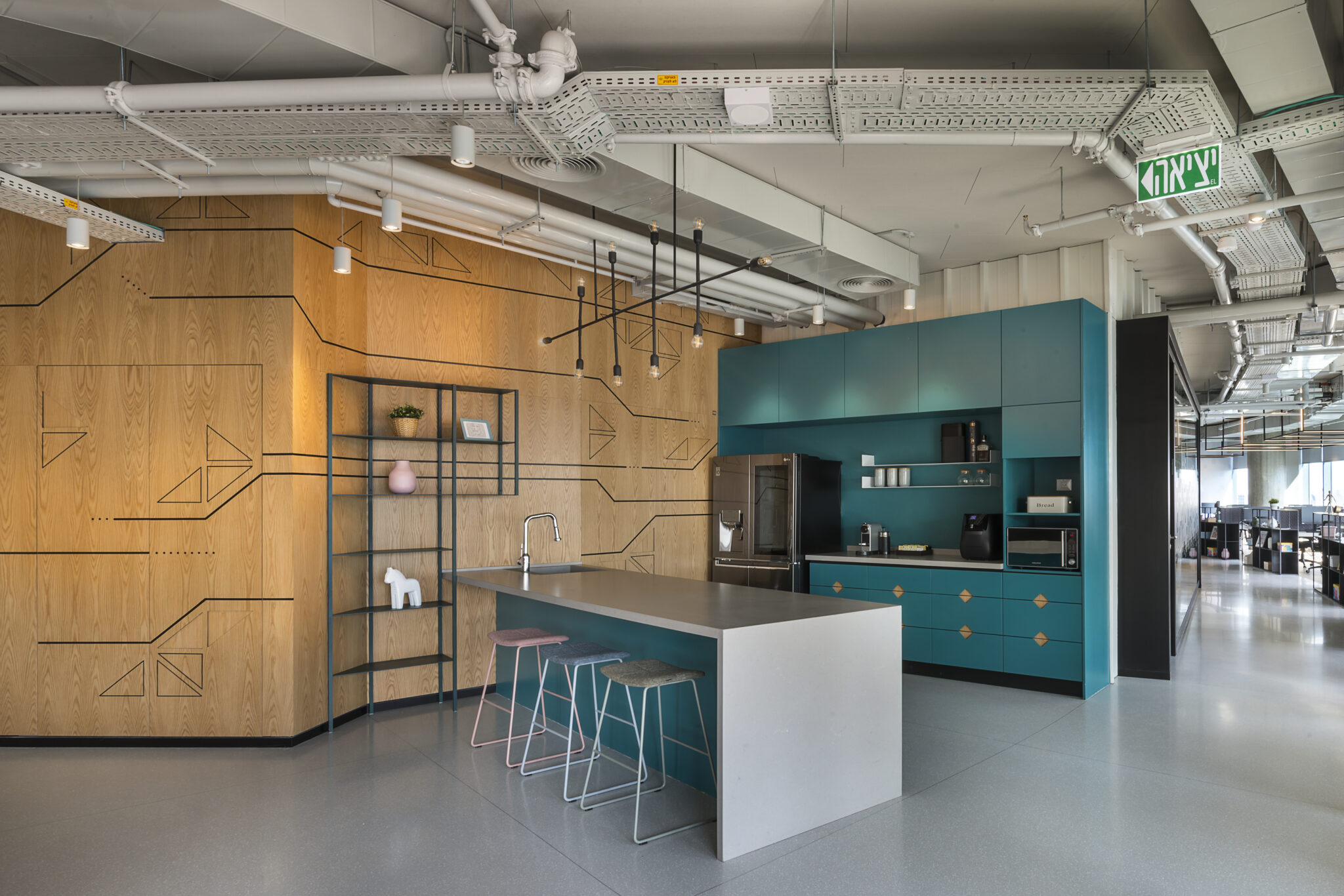 Black circuit line graphics inlaid on a wood wall by the kitchen