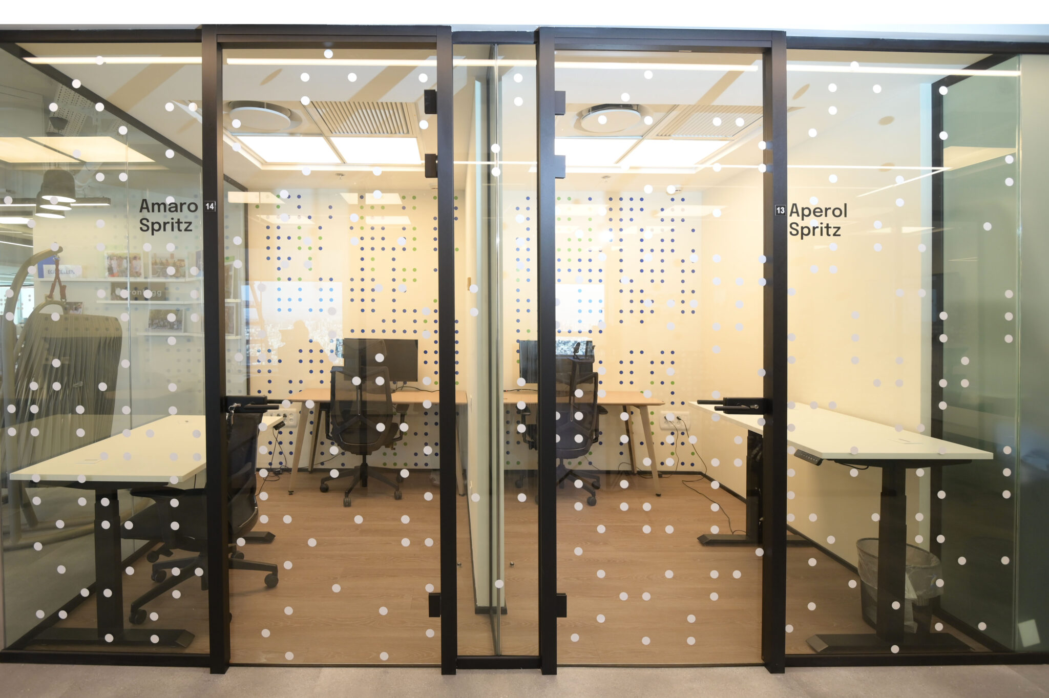 Dot film on booth glass with cocktail room names in vinyl