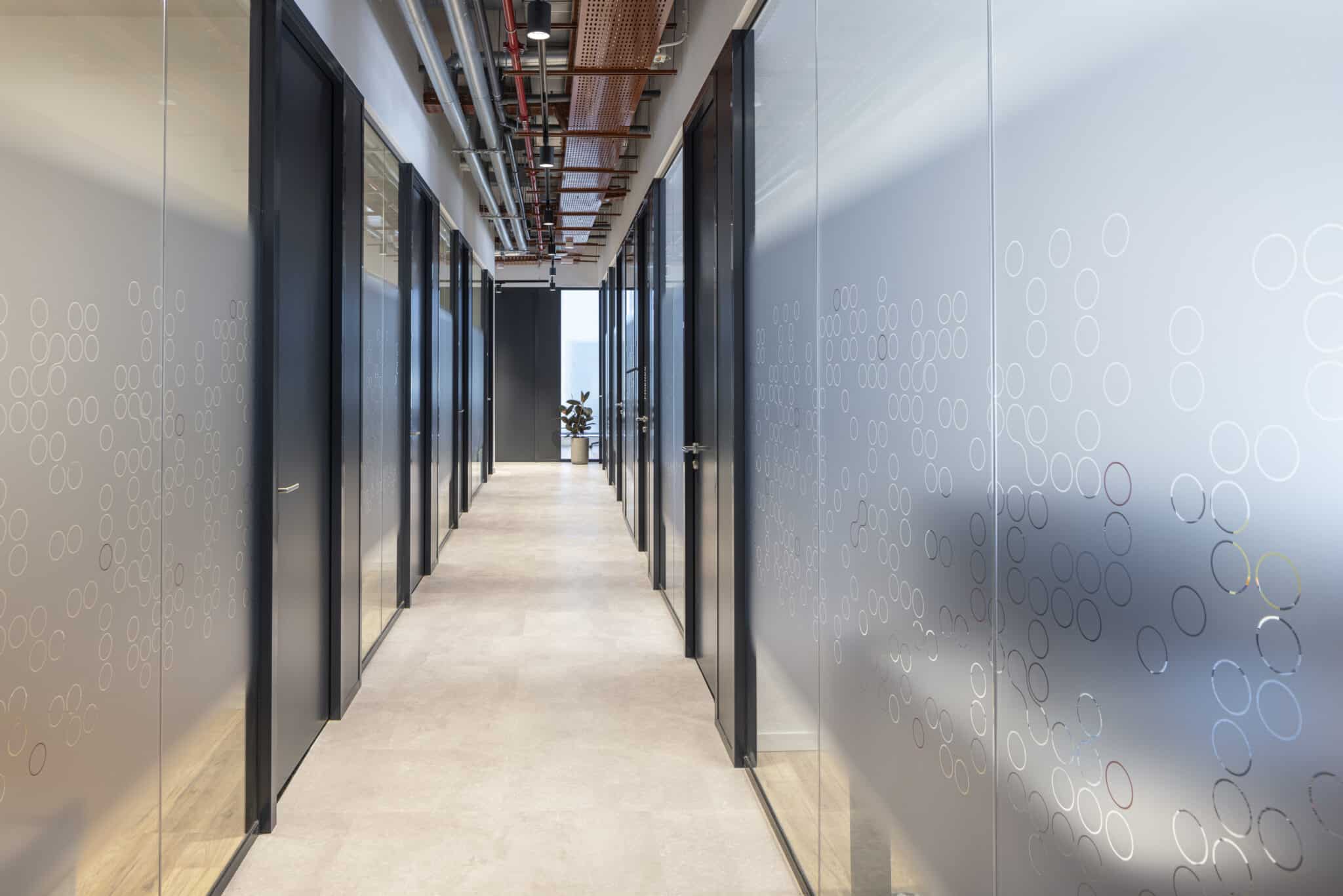 Frosted glass office fronts with a coral gradient panel