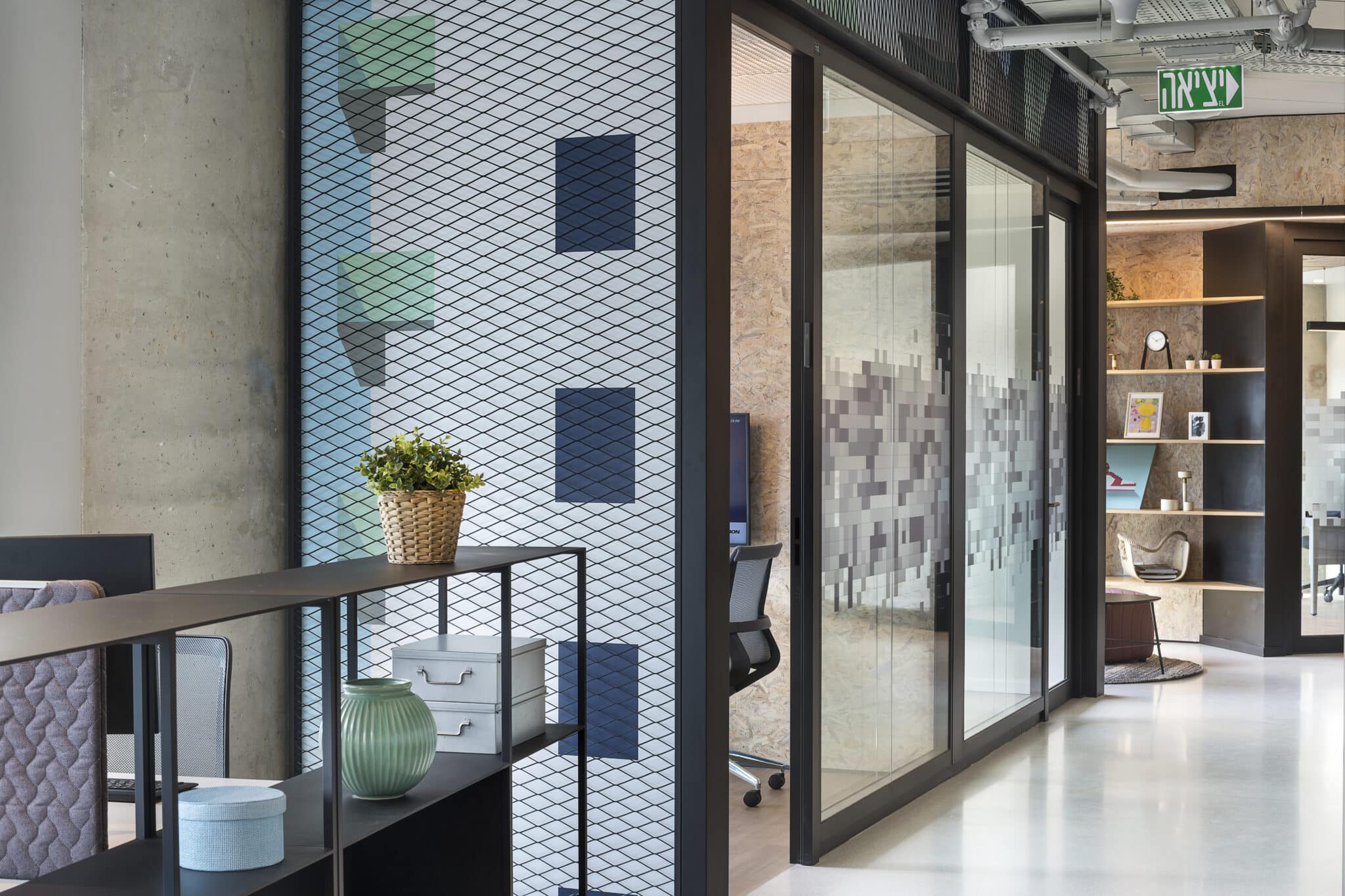 Patterned printed glass beside pixel-pattern glass in an office