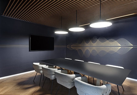 Gold sound-wave line graphic on a dark blue meeting room wall
