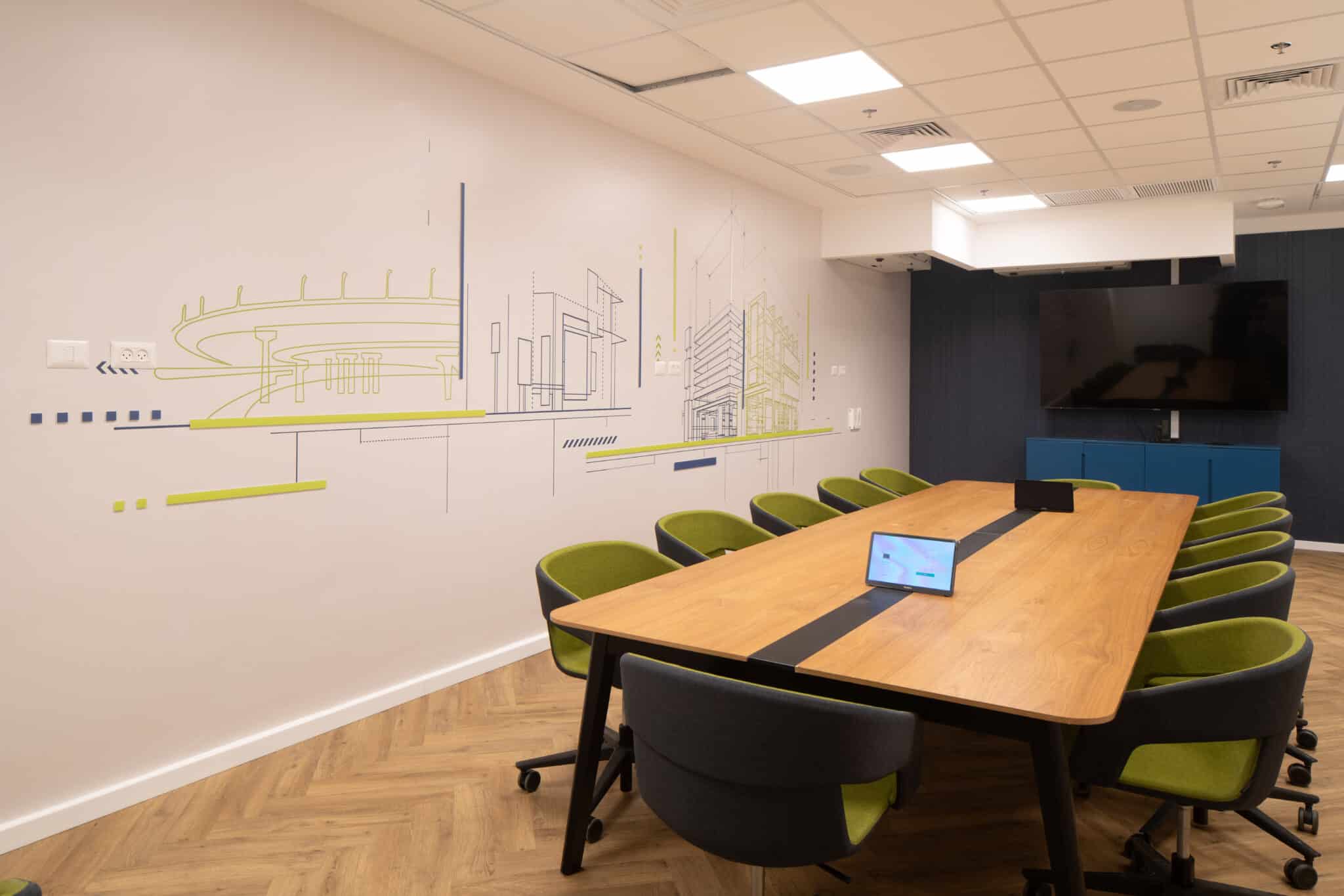 Line drawing wall graphic of an industrial plant in a meeting room