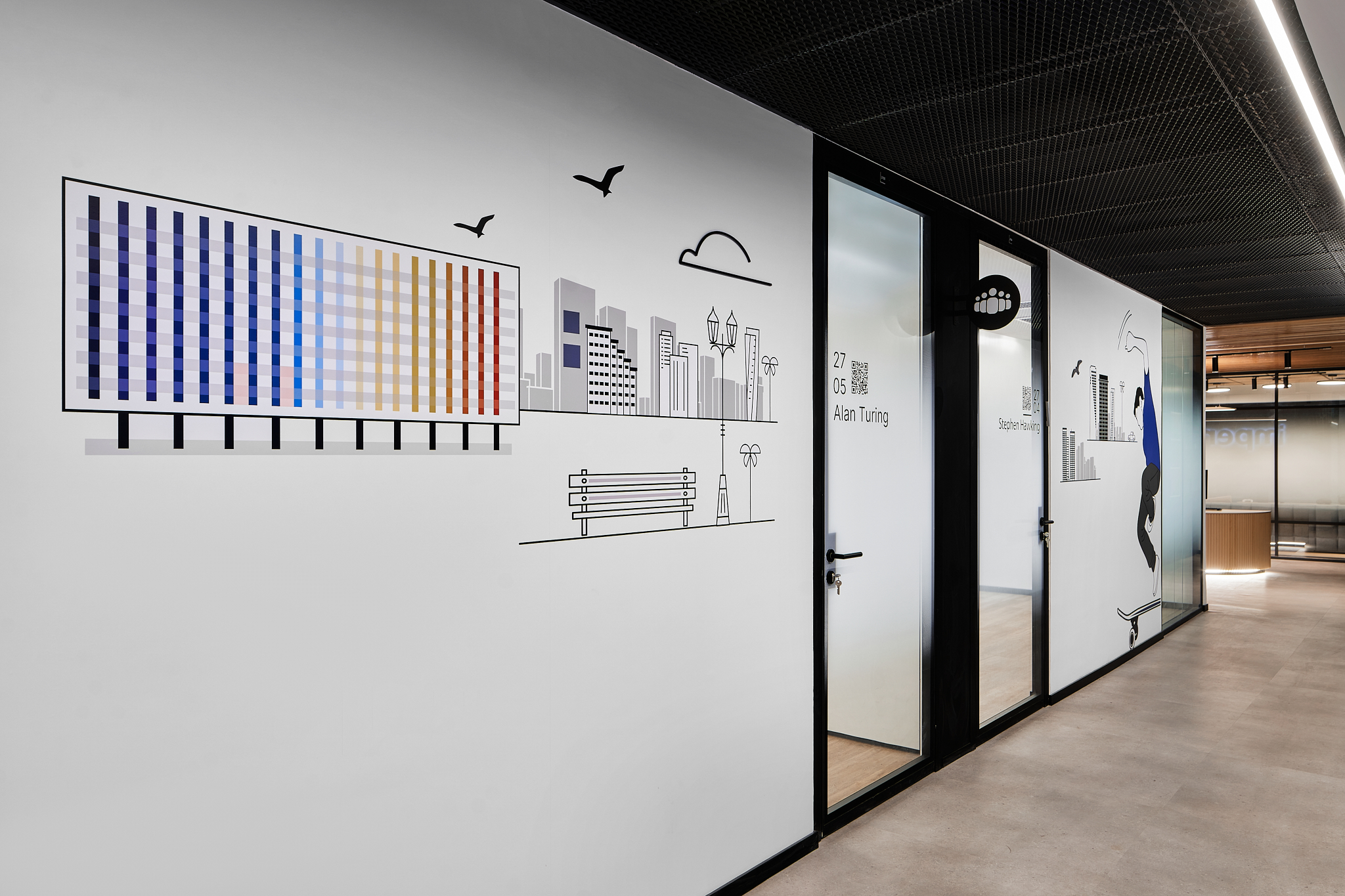 City line wall graphic with a colour grid billboard beside room signage
