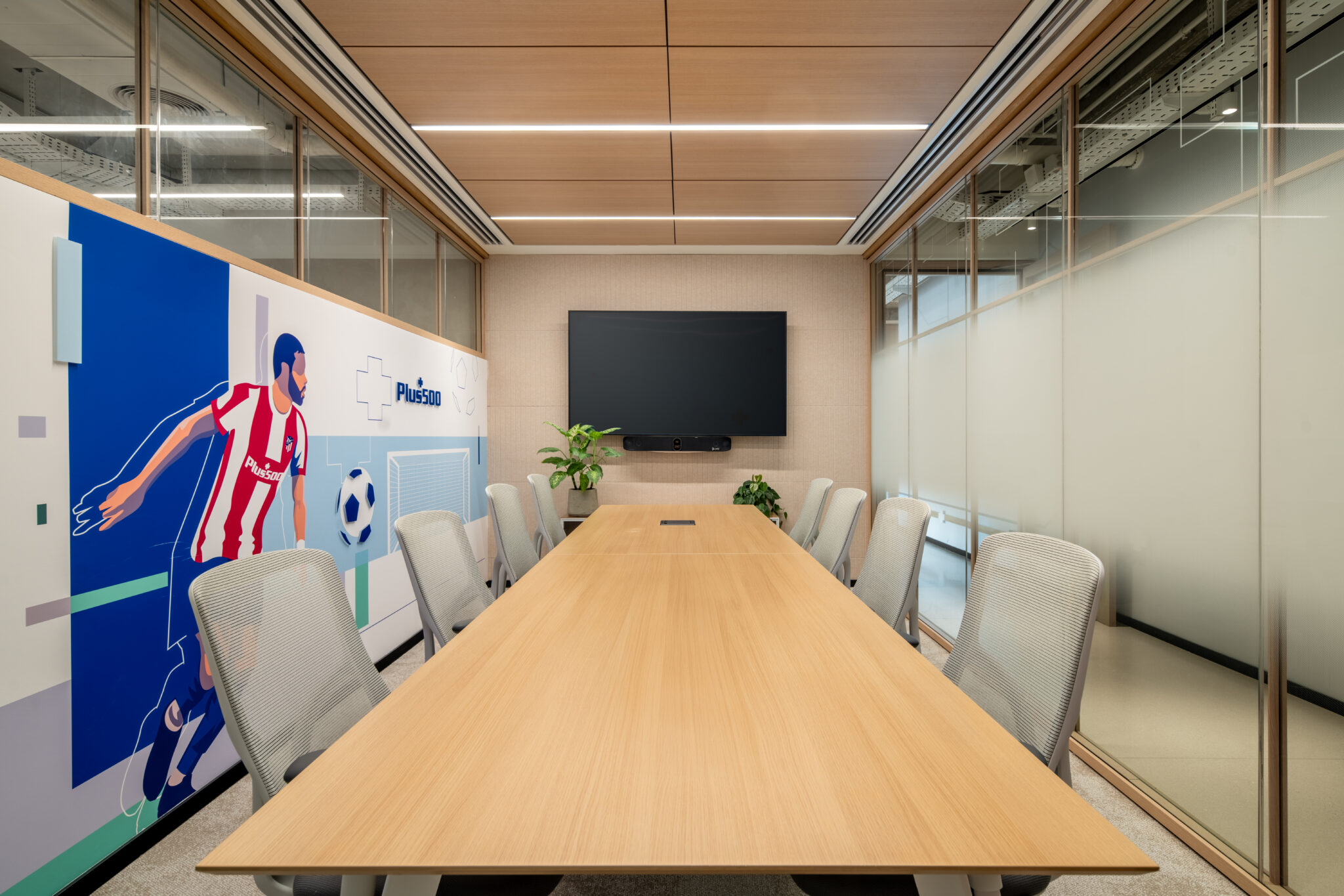 Footballer wall graphic along a meeting room wall