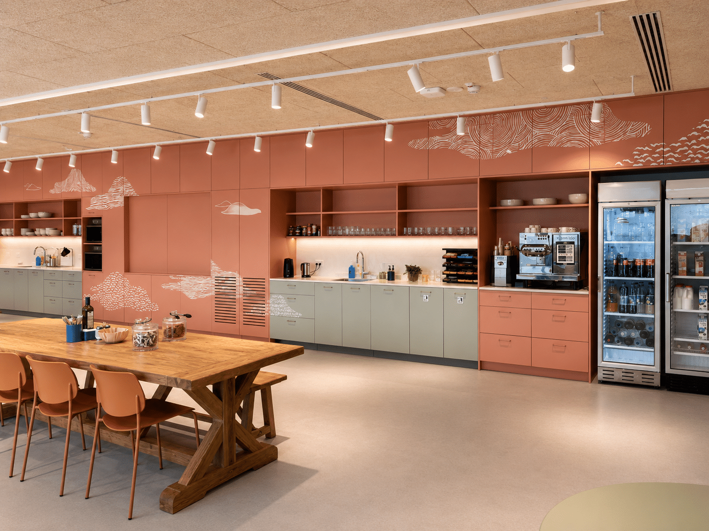 Cloud line graphics on terracotta kitchen cabinet fronts