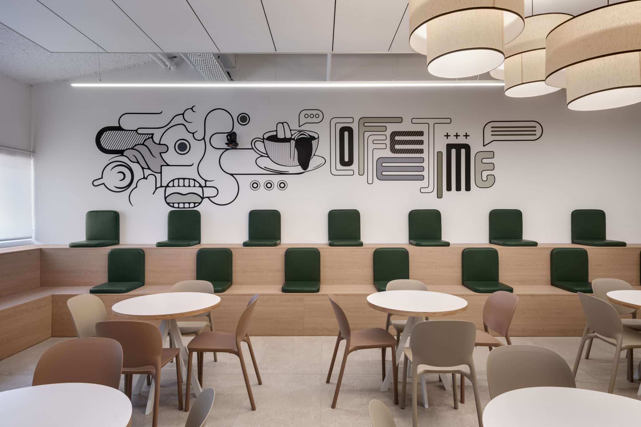 Line drawing wall mural with coffee time lettering above bench seating