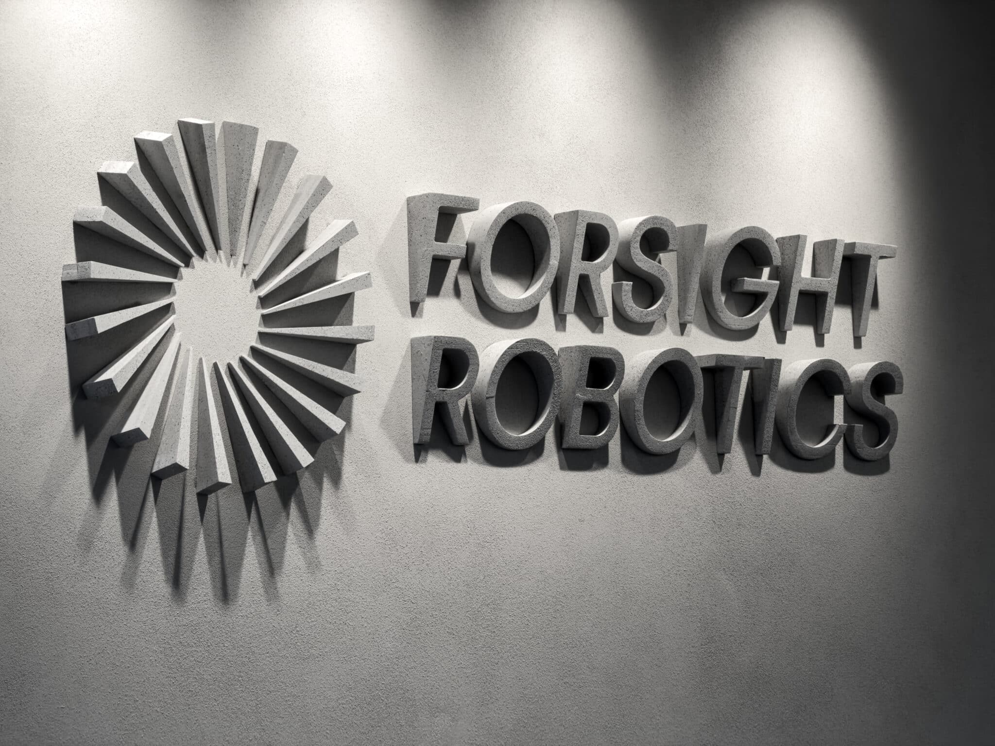 Forsight Robotics 3D logo with a radial element on a concrete wall